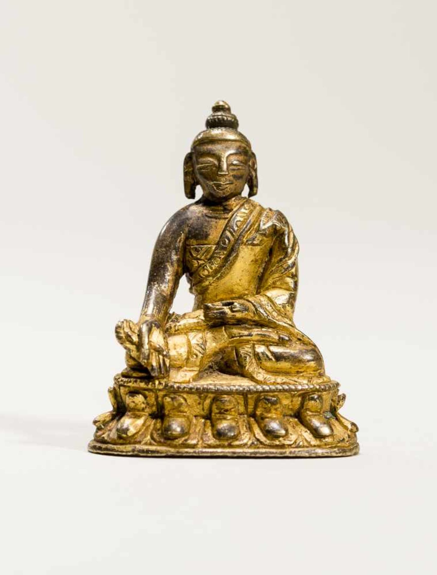 A TIBETAN MINIATURE BRONZE OF BHAISAJYAGURU, 18TH-19TH CENTURYBronze with gildingTibet, 18th to 19th