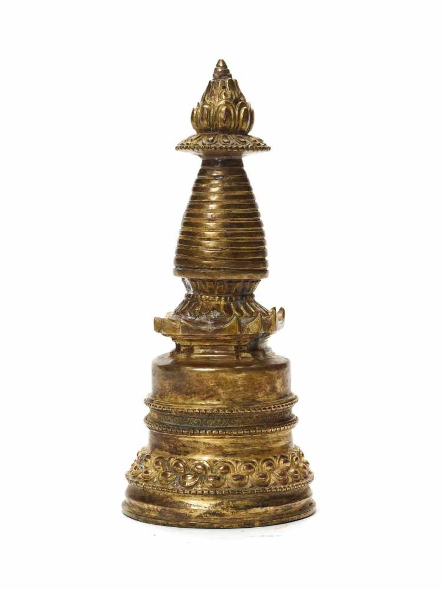 A TIBETO-CHINESE GILT BRONZE STUPA, 20th CENTURYMassively cast with some neatly incised detail work,