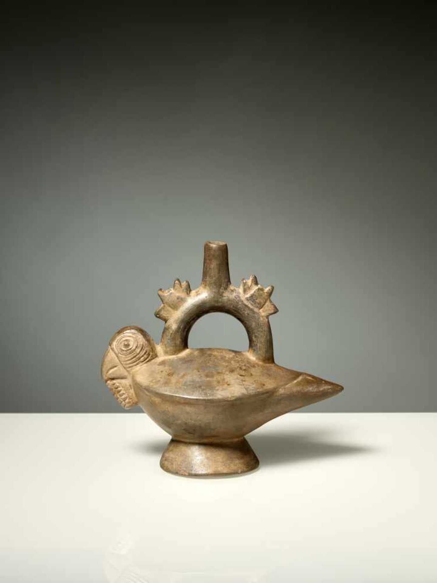 STIRRUP VESSEL WITH PARROT – CHIMU CULTURE, PERU, C. 1000-1400 ADBlack fired clayChimu culture,