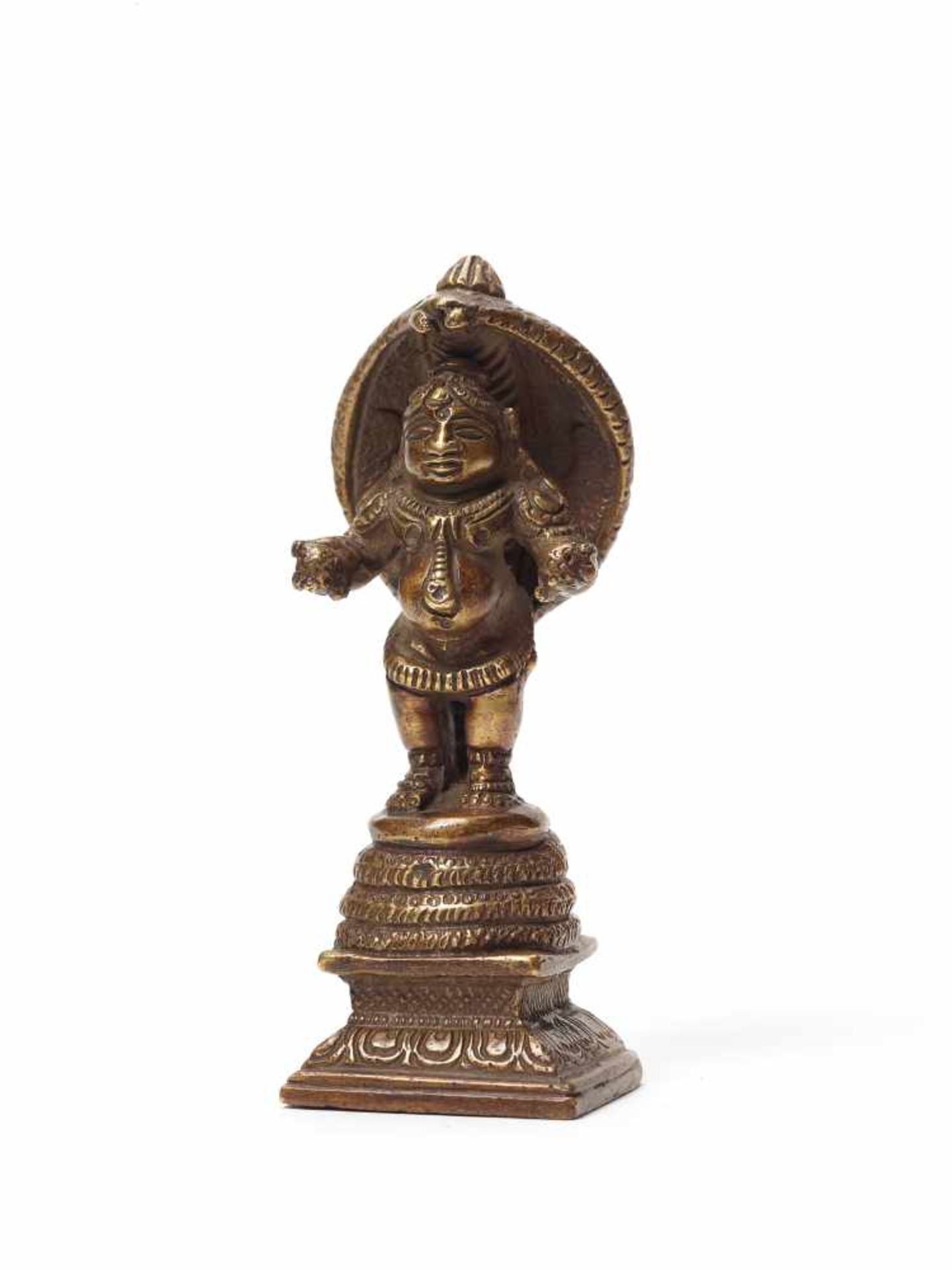 A RARE INDIAN BRONZE OF STANDING KRISHNA WITH NAGAYellow bronzeSouth-India, 19th centuryA rare and