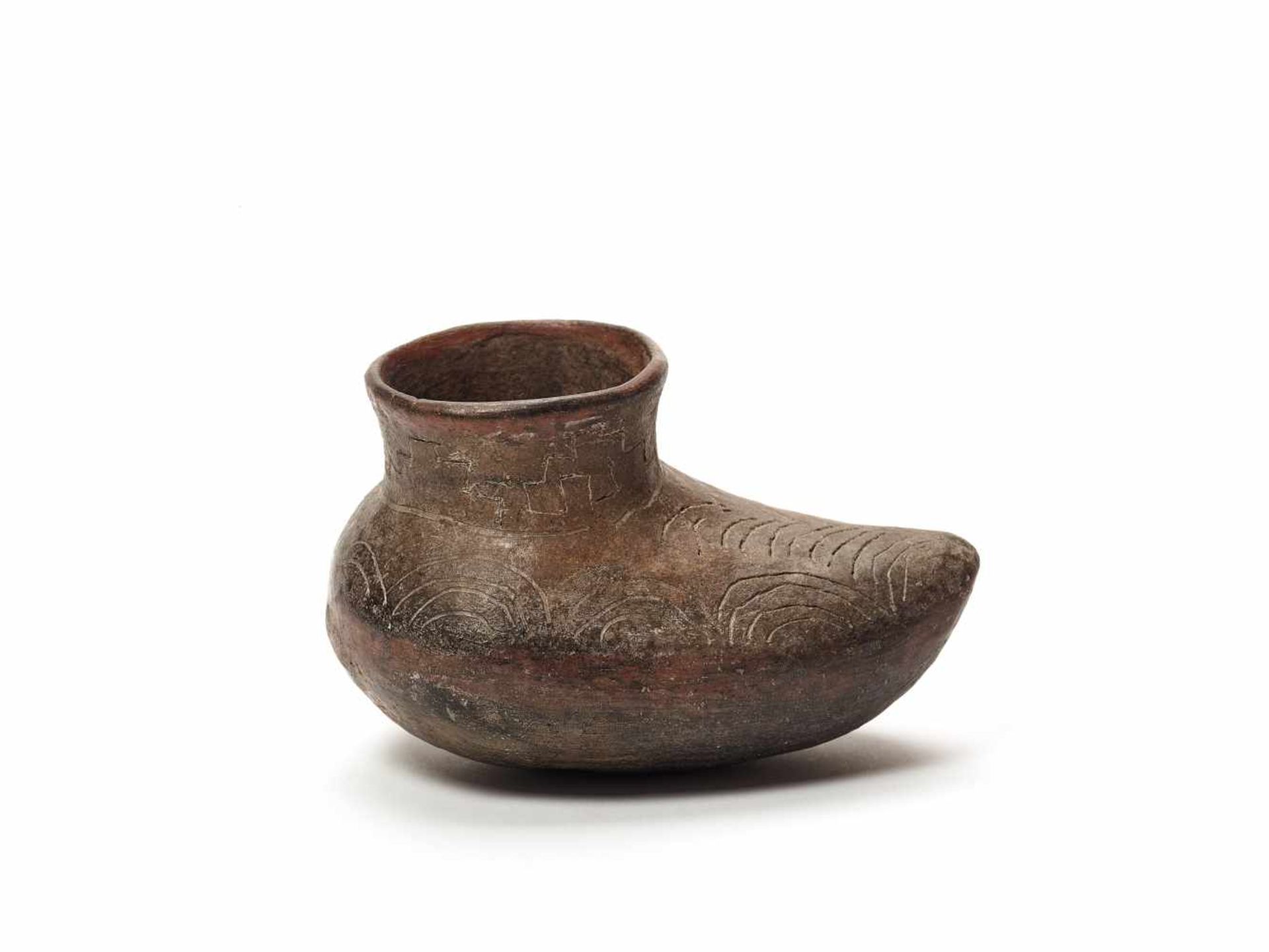 SHOE-SHAPED VESSEL - CHAVIN CULTURE, PERU, C. 500 BCBlack fired clayChavin culture, Peru, c. 500