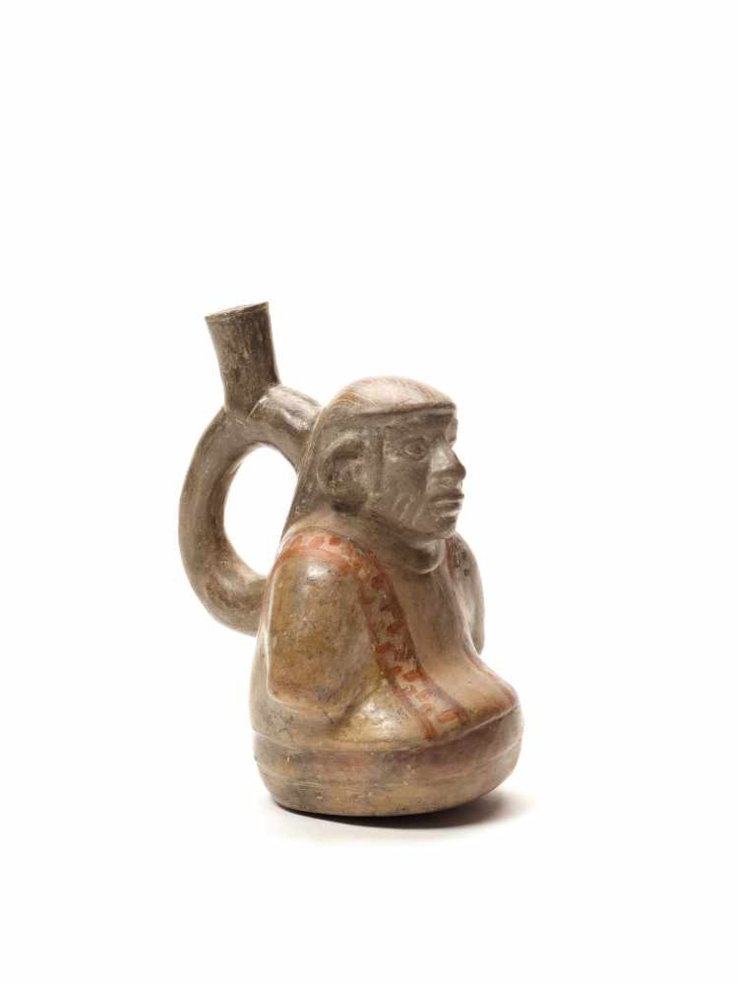 MAN IN PONCHO SHAPED VESSEL – MOCHE CULTURE, PERU, C. 200 - 400 ADFired clay painted in shades of