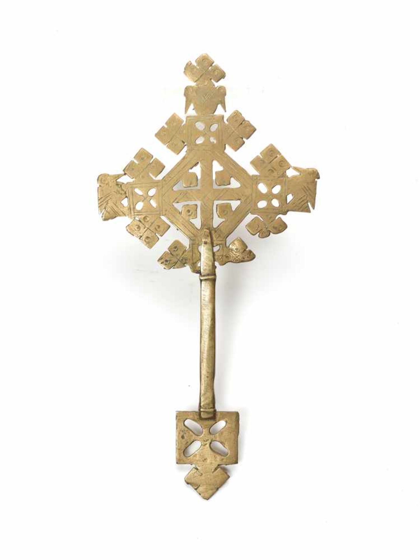 AN ETHIOPIAN PROCESSIONAL CROSS, CHASED AND OPENWORKED BRASS, 19TH CENTURYBrassEthiopia, late 19th