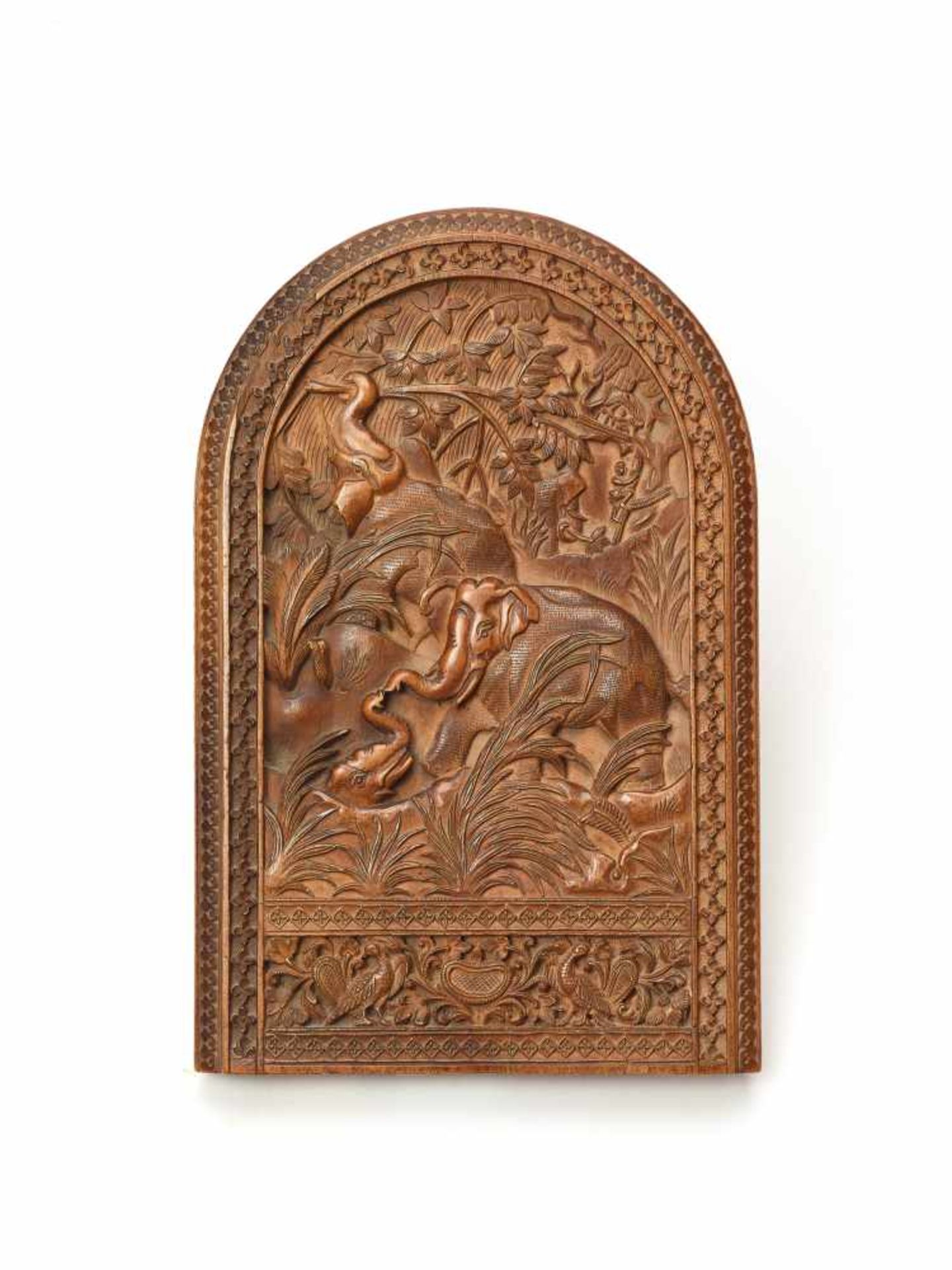 AN INDIAN CARVED WOOD RELIEF WITH ELEPHANTSWoodIndia, 20th centuryThe wood carving shaped like a