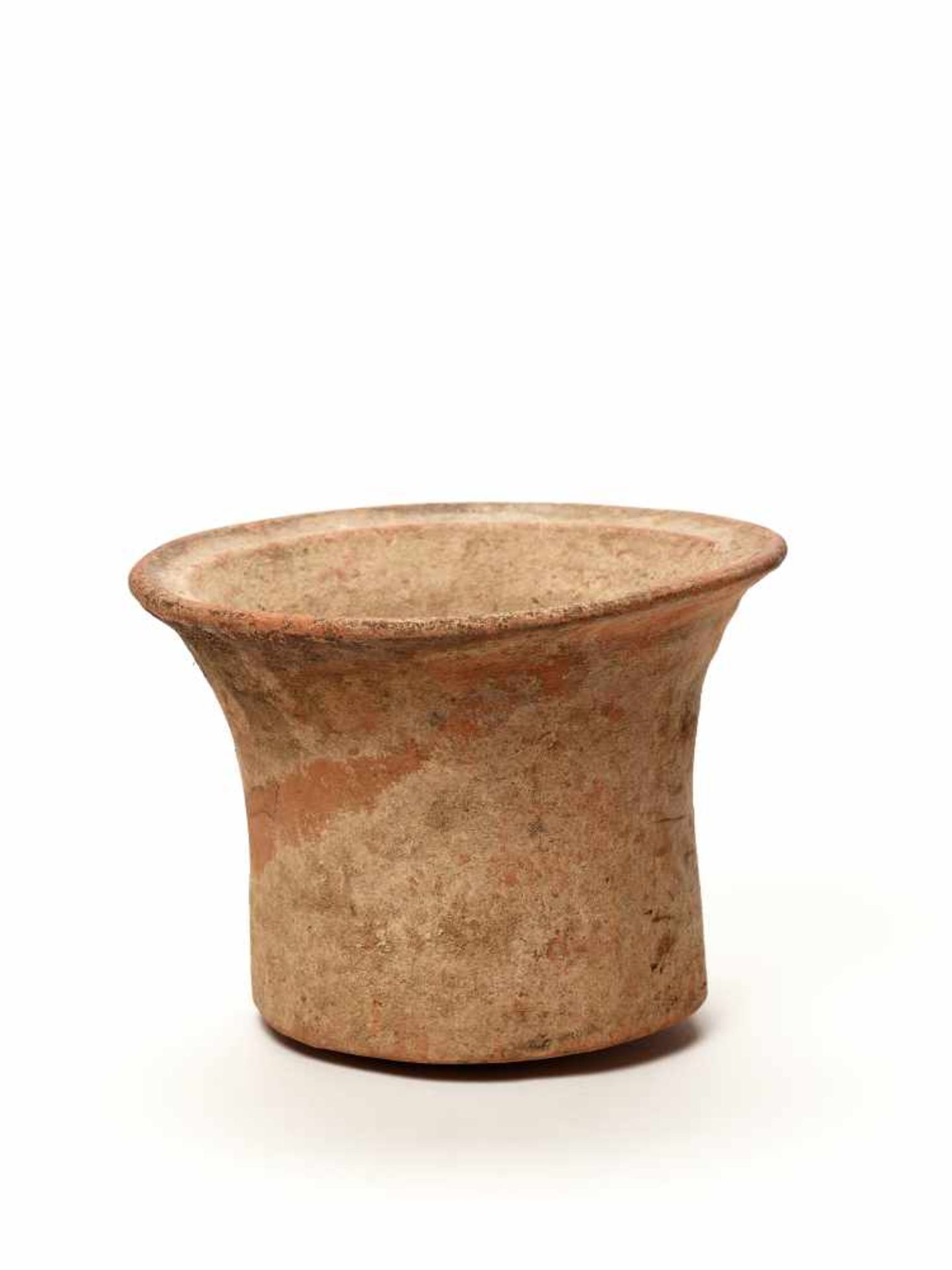 A BAN CHIANG TERRACOTTA VESSEL, 3000 BCThe sturdily potted vessel with a sprawling lip and a
