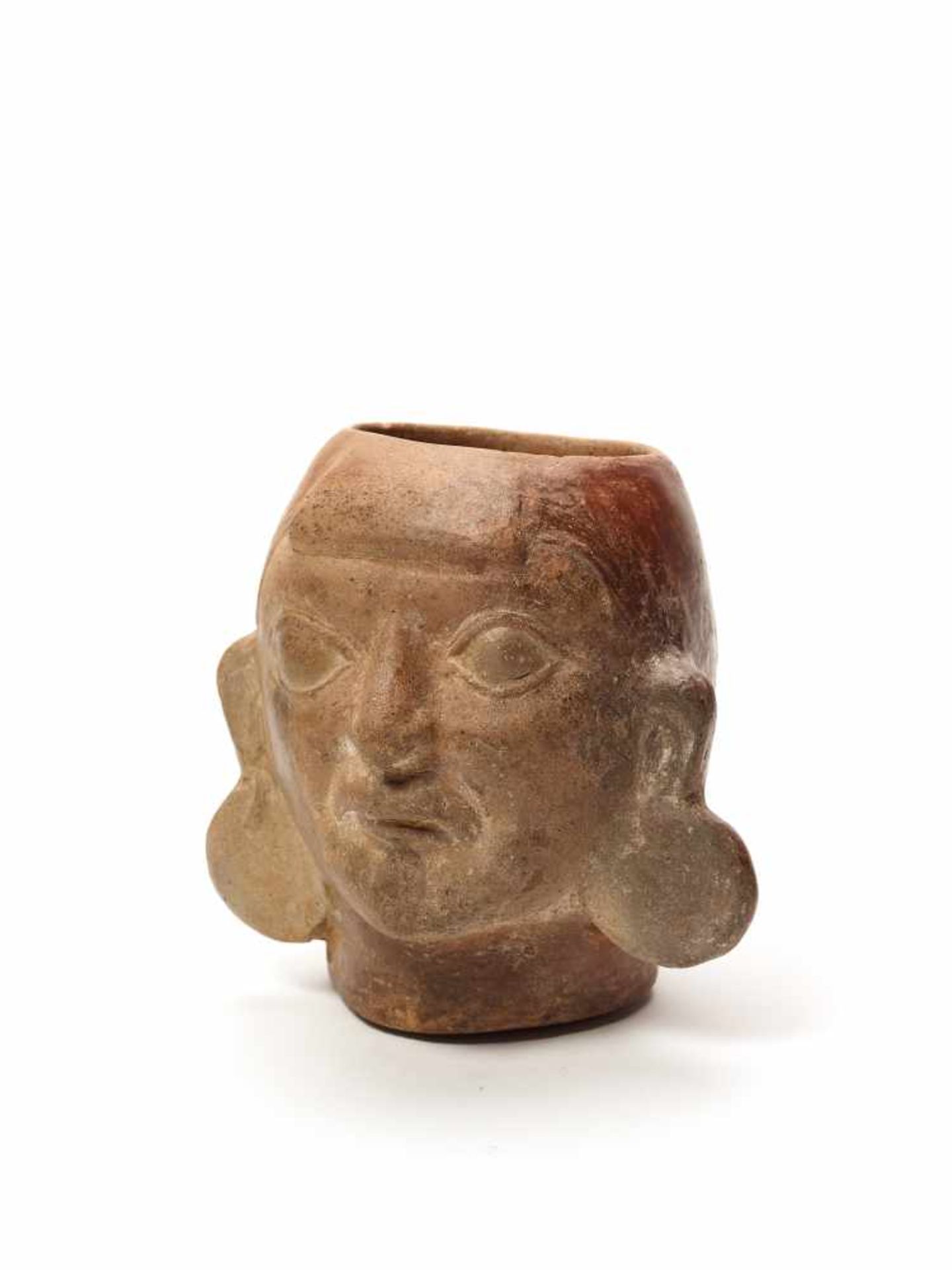 MUG IN THE SHAPE OF A HEAD – MOCHE CULTURE, PERU, C. 500 ADFired clayMoche culture, Peru, c. 500