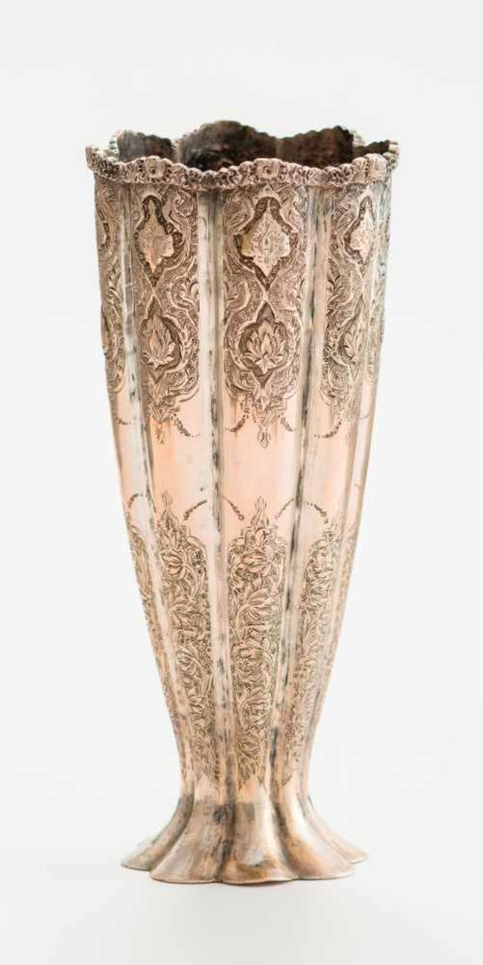 A GOBLET-SHAPED SILVER VASESilverPersia, 19th centuryA silver eight-lobed vase rising from a