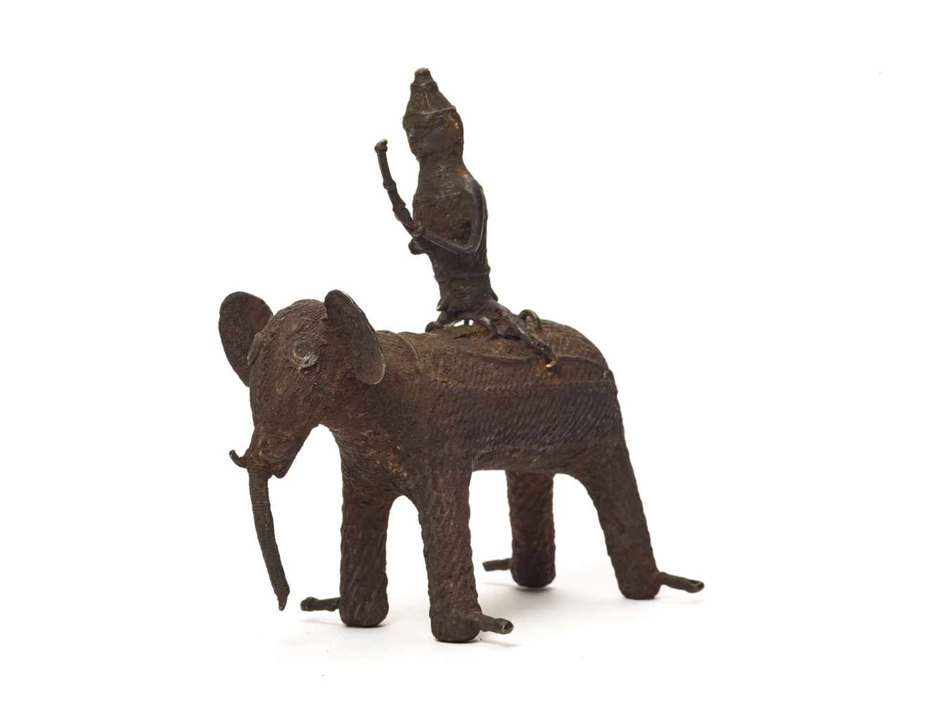 A KONDH TRIBAL BRONZE GROUP OF A WARRIOR RIDING AN ELEPHANT Copper bronzeEastern India, Kondh Tribe,