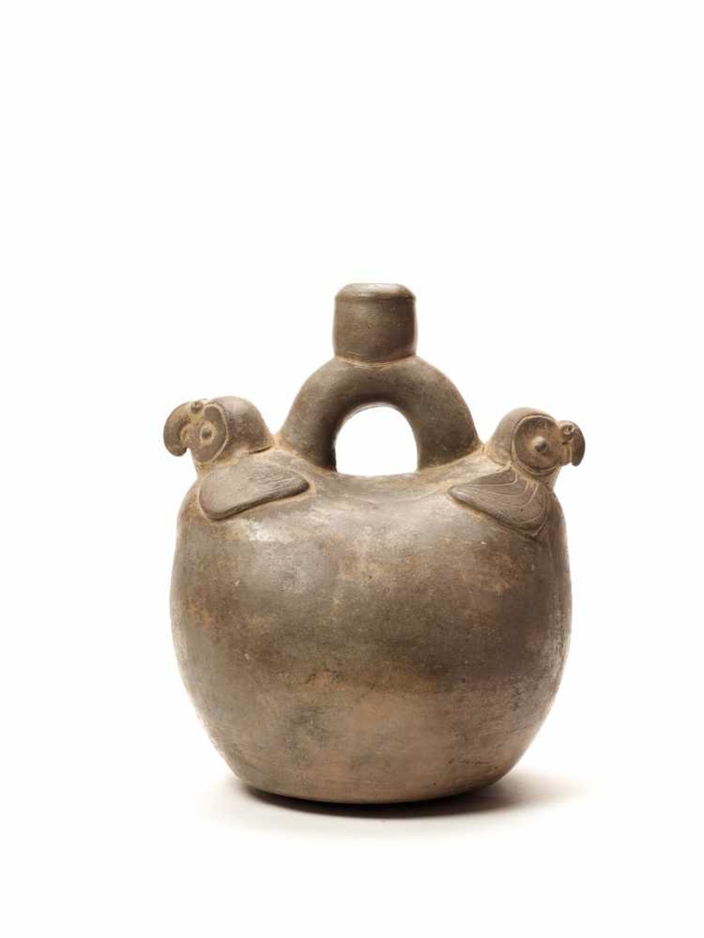 TL-TESTED TWO PARROTS STIRRUP VESSEL - CHAVIN CULTURE, PERU, C. 5TH CENTURY BCGrayish fired