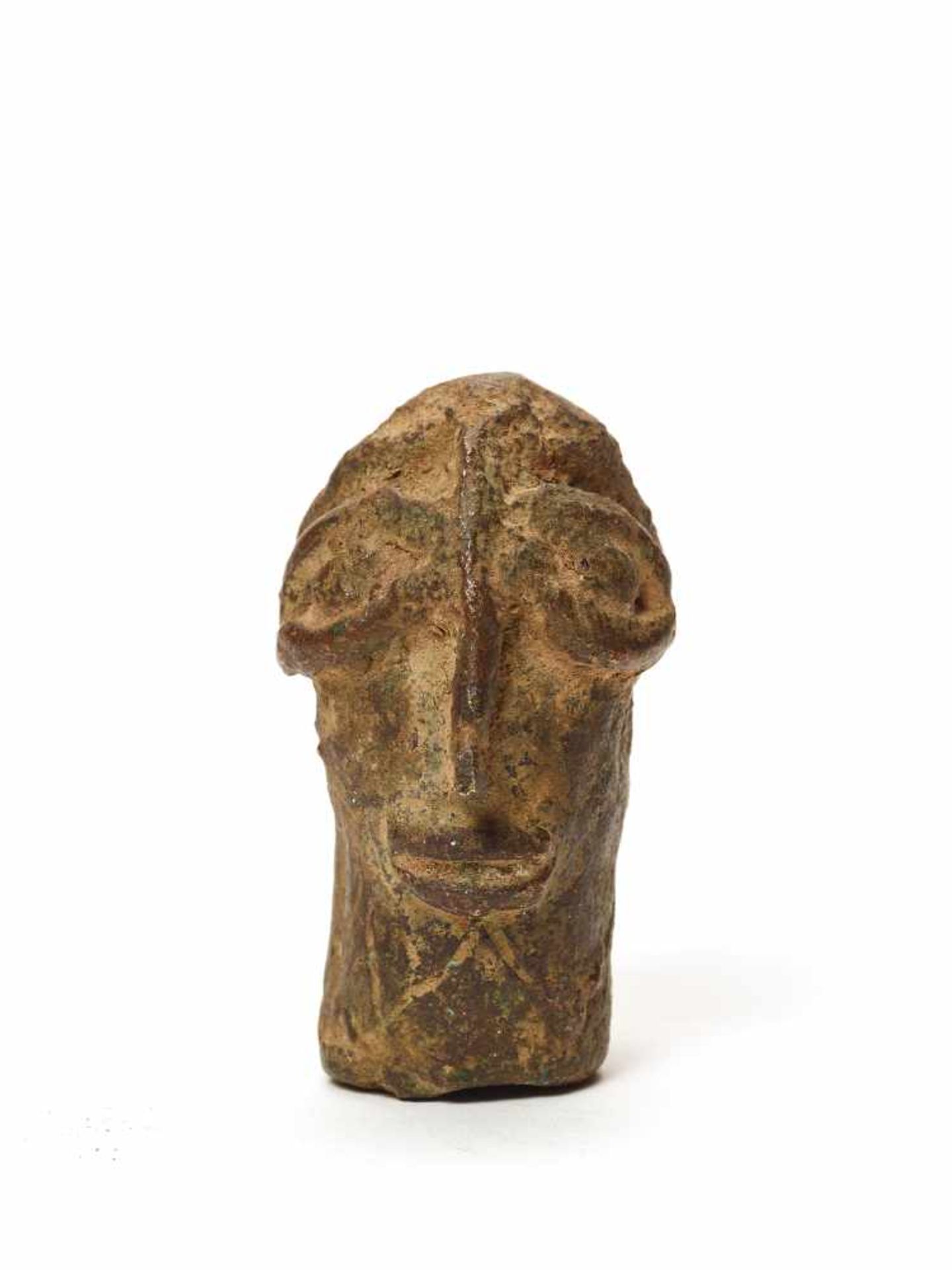 A CAST BRONZE BENIN STYLE HEADMassive casting with solid age patinaBenin, 20th century Dimensions: