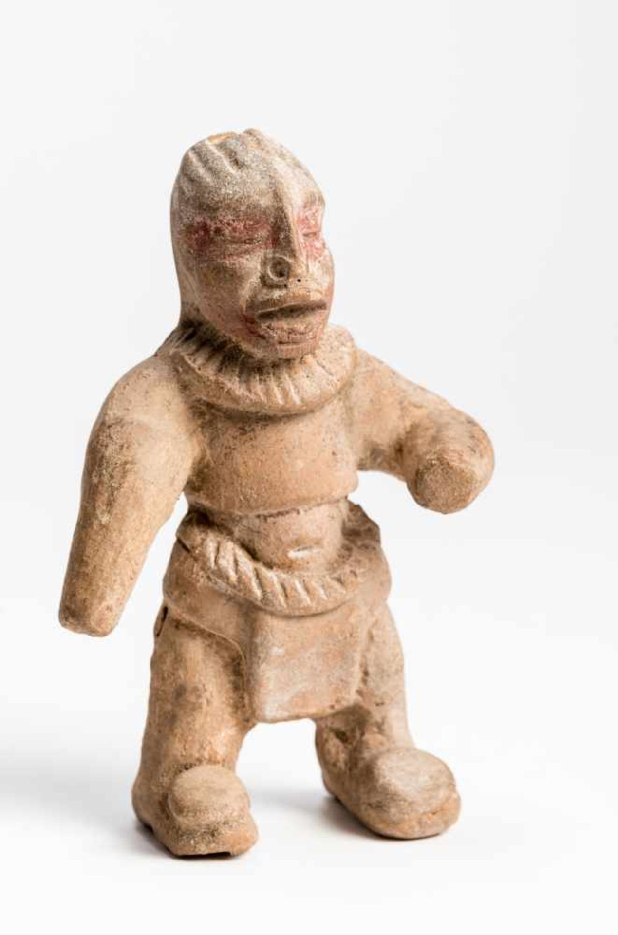 PRIEST FIGURETerracottaGuatemala, Maya culture, ca. 500 - 800Stocky priest standing in a loincloth