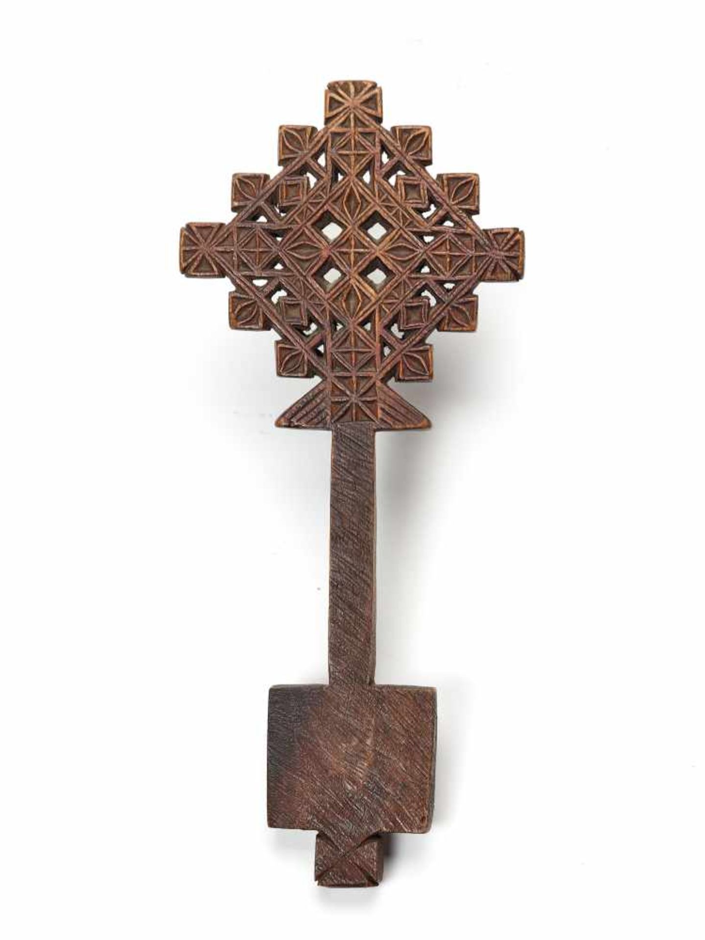 AN ETHIOPIAN PROCESSIONAL CROSS, CARVED AND OPENWORKED WOOD, 19TH CENTURYWoodEthiopia, late 19th