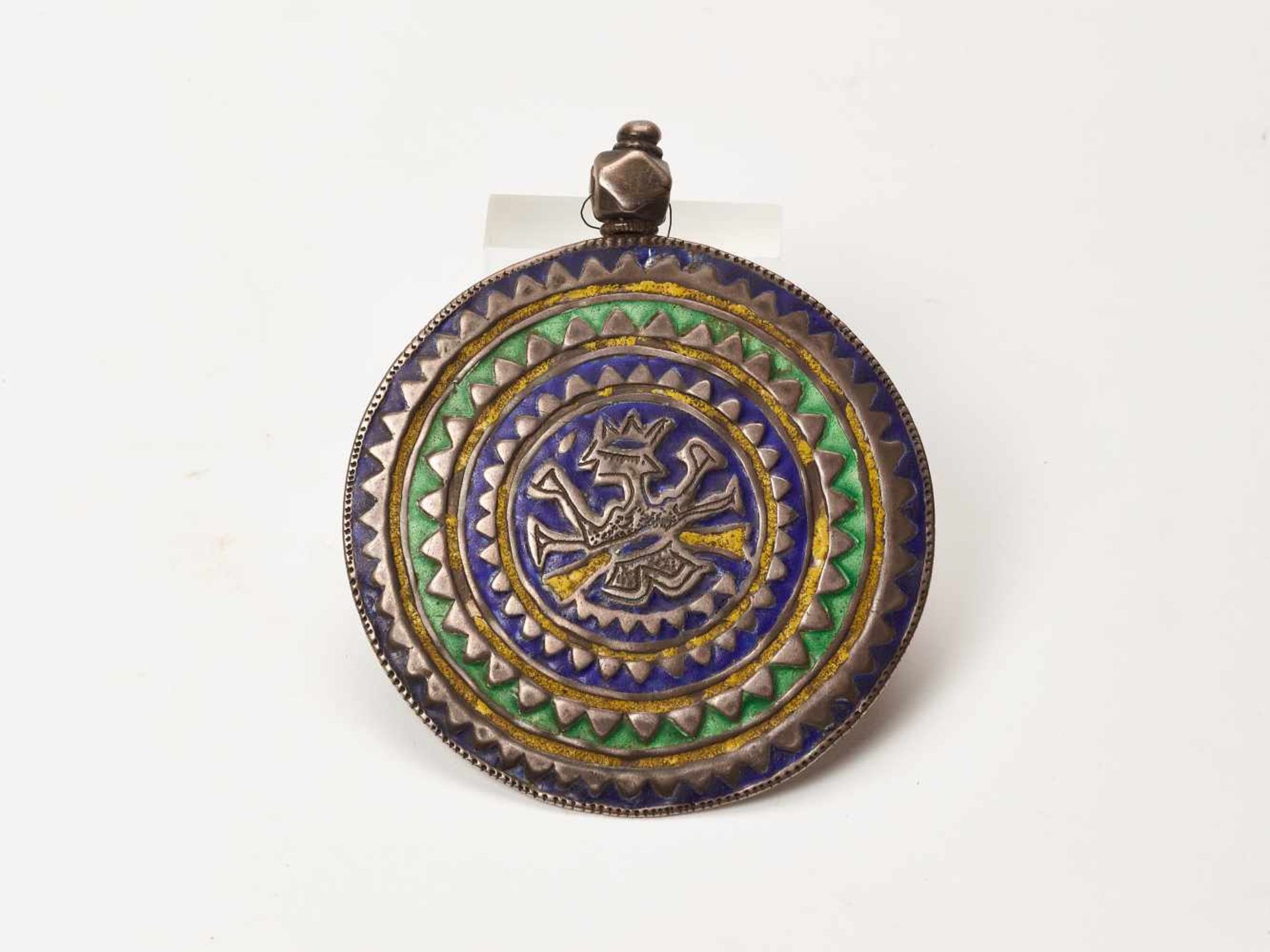 AN INDIAN SILVER AND ENAMEL AMULET, 19TH CENTURYSilver, enamelIndia, 19th centuryThis silver and