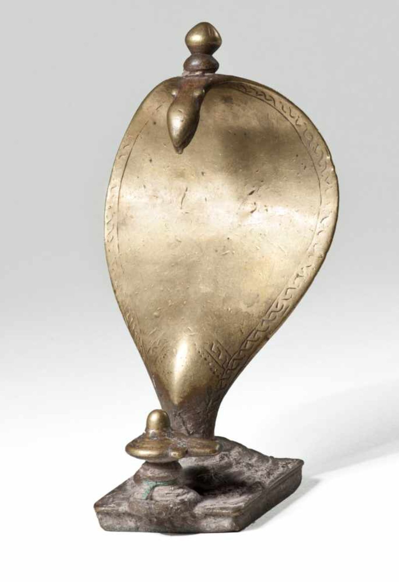 YONILINGA WITH NAGABrass-bronze India, Karnataka or Maharastra, 18th to mid 19th century Dimensions: