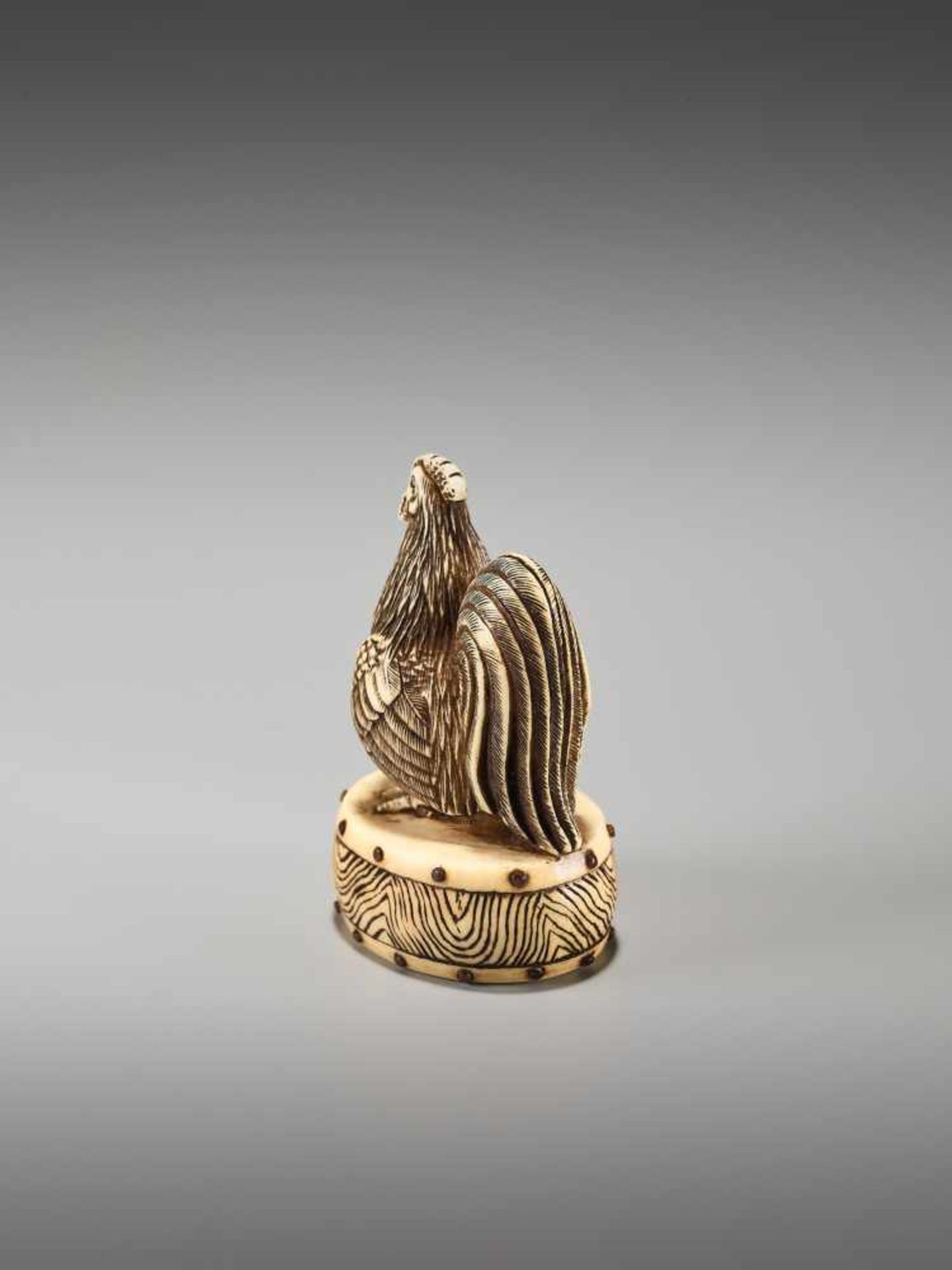 A FINE NETSUKE OF A COCKEREL ON A DRUM BY KOJITSU By Kojitsu, ivory netsuke with horn inlayJapan, - Image 3 of 12