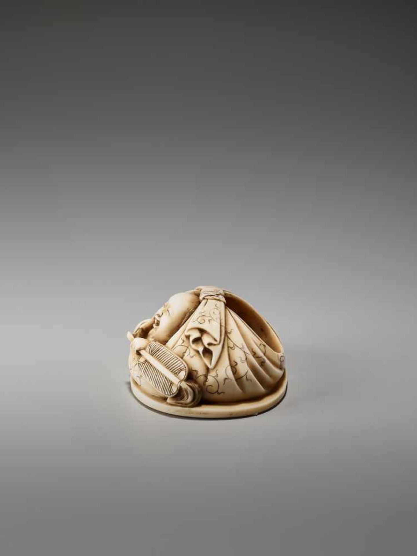 AN IVORY NETSUKE OKIMONO OF A BOY IN HOTEI’S BAGSigned in seal form Tanaka, ivory netsuke- - Image 4 of 8