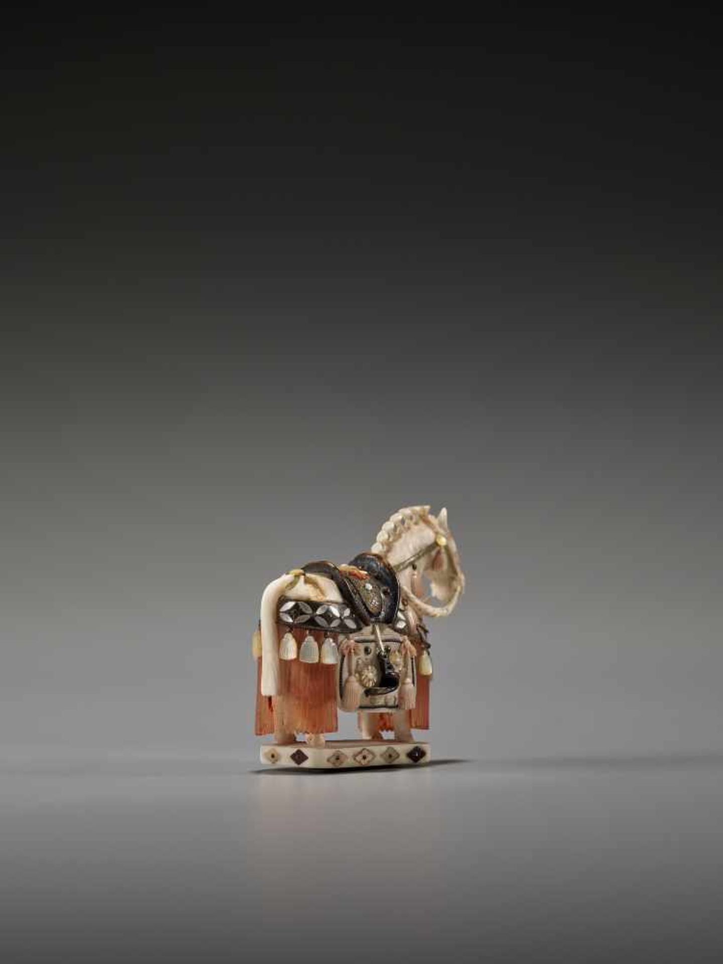 A SHIBAYAMA STYLE INLAID IVORY NETSUKE OF A CAPARISONED HORSE BY KAZUAKIBy Kazuaki, ivory netsuke - Image 6 of 8