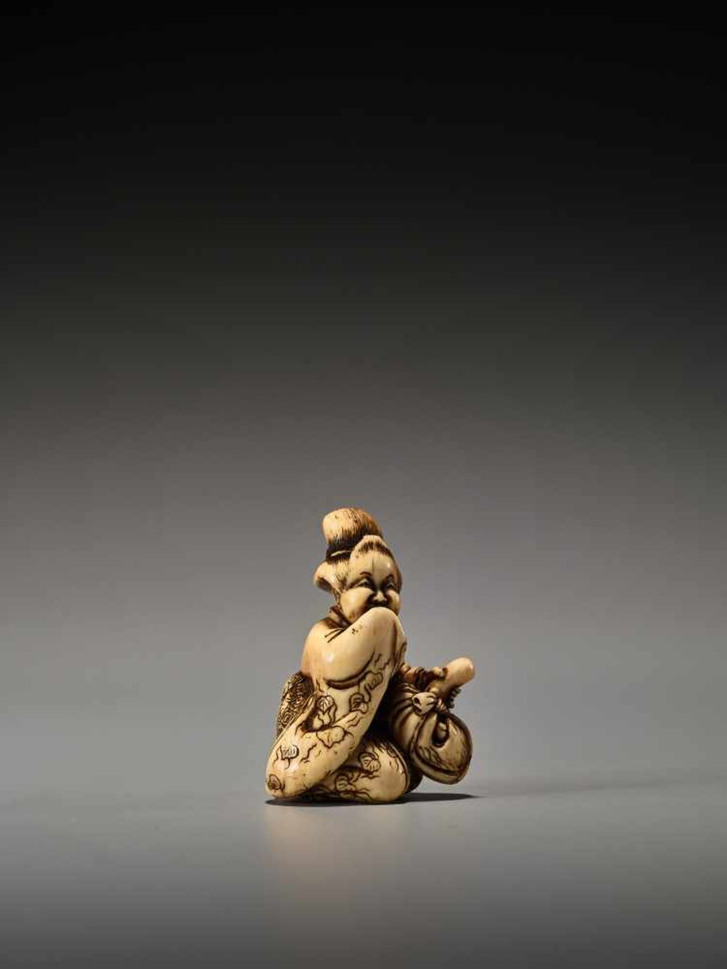 A RARE IVORY SHUNGA NETSUKE OF OKAME WITH TENGU MASK BY SHUOSAI HIDEMASABy Shuosai (Hidemasa), ivory - Image 6 of 9