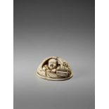 AN IVORY NETSUKE OKIMONO OF A BOY IN HOTEI’S BAGSigned in seal form Tanaka, ivory netsuke-