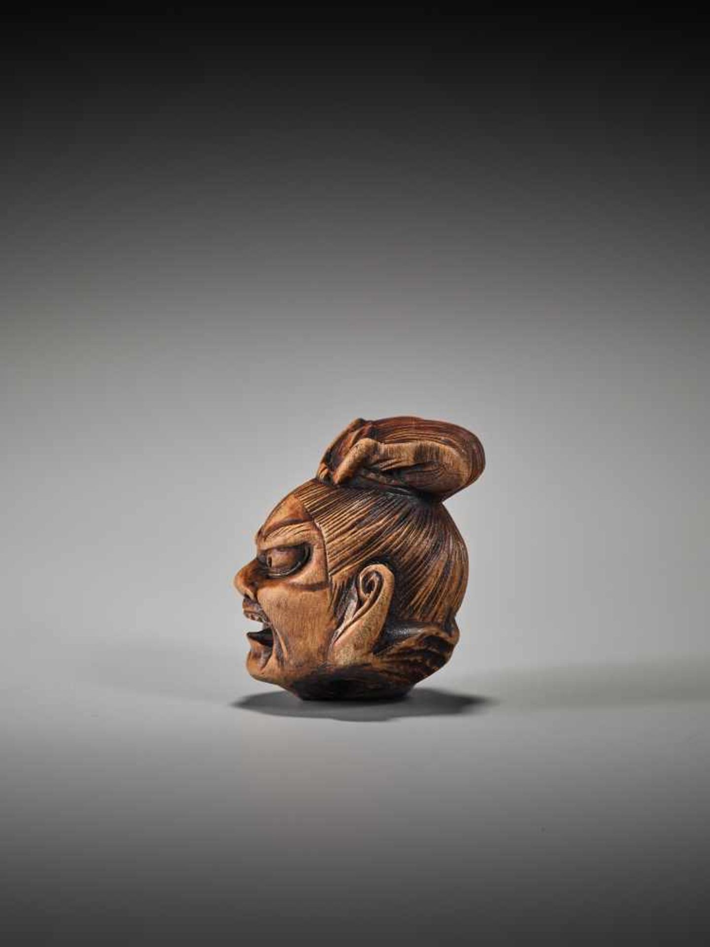 A WOOD NETSUKE OF A SEVERED NIO HEADUnsigned, wood netsukeJapan, 19th century, Edo period (1615- - Image 3 of 6