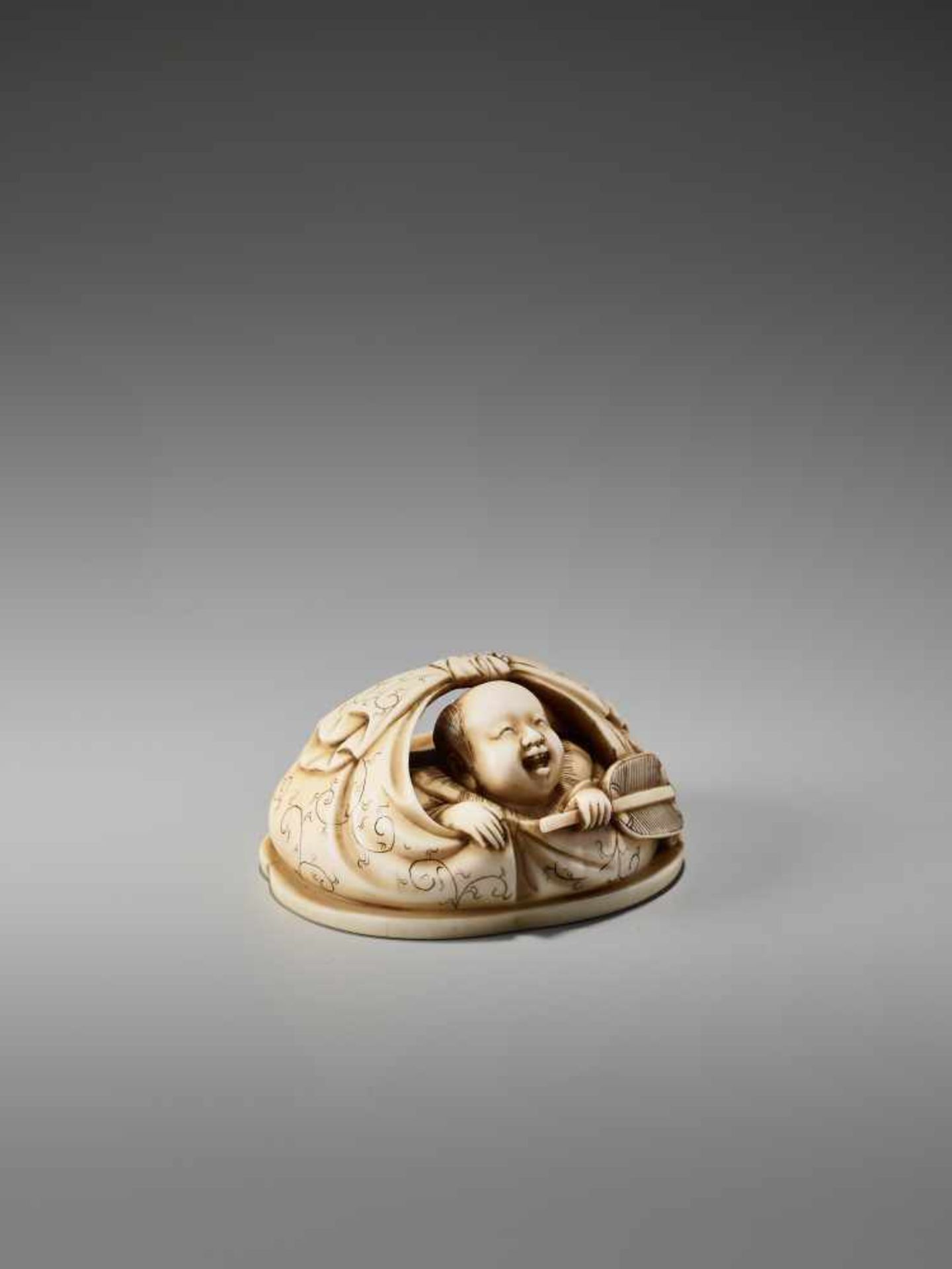 AN IVORY NETSUKE OKIMONO OF A BOY IN HOTEI’S BAGSigned in seal form Tanaka, ivory netsuke- - Image 6 of 8