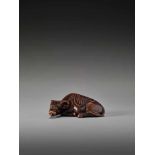 A RARE WOOD NETSUKE OF A RECUMBENT OX SIGNED TOMOTADASigned Tomotada, wood netsukeJapan, 19th