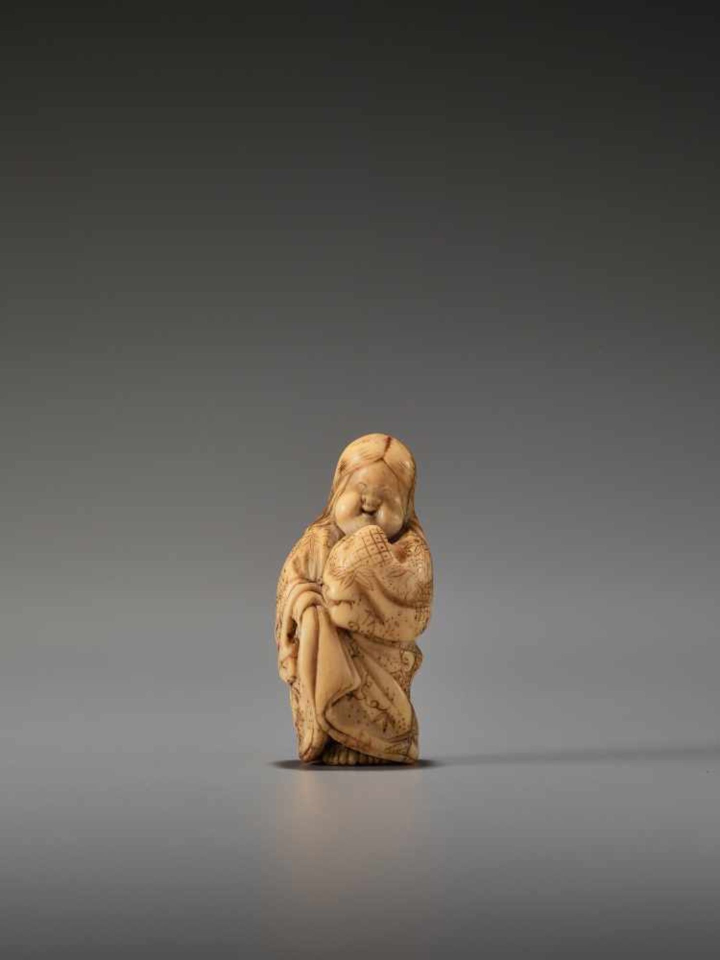 A FINE IVORY NETSUKE OF OKAME LAUGHINGUnsigned, ivory netsukeJapan, late 18th to early 19th century,