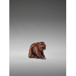 A WOOD NETSUKE OF A TIGERUnsigned, wood netsukeJapan, early 19th century, Edo period (1615-1868)