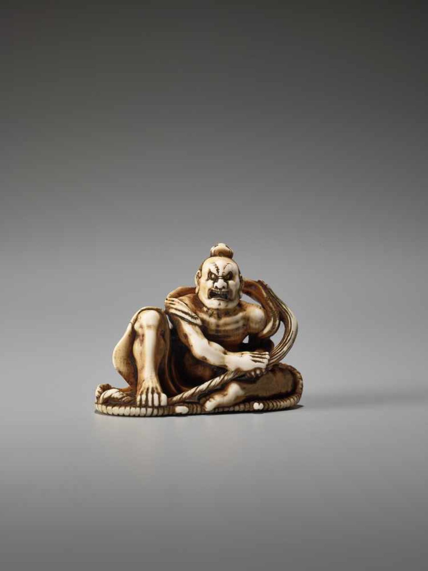 AN IVORY NETSUKE OF A POWERFUL NIO ON A SANDAL BY TOMOMASABy Tomomasa, ivory netsukeJapan, Edo, - Image 2 of 9