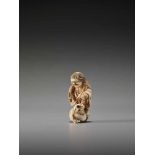 AN IVORY NETSUKE OF GAMA SENNIN WITH LARGE TOADUnsigned, ivory netsukeJapan, 19th century, Edo