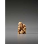 AN IVORY SHUNGA NETSUKE OF A MAN TASTING A CLAM BY THE TOMOCHIKA SCHOOLBy Tomochika, ivory shunga