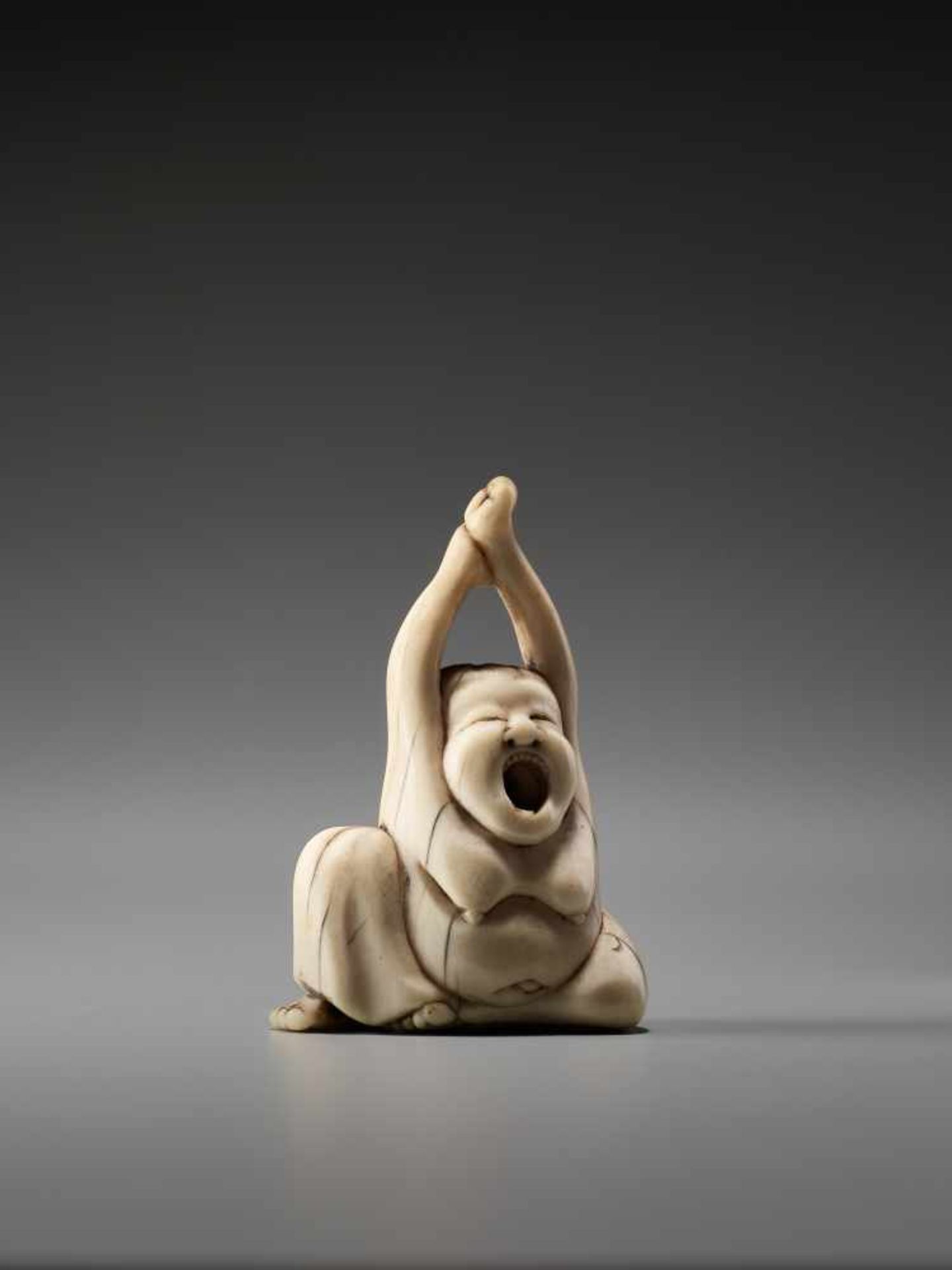 AN IVORY NETSUKE OF OKAME YAWNINGUnsigned, ivory netsukeJapan, early 19th century, Edo period ( - Image 5 of 6