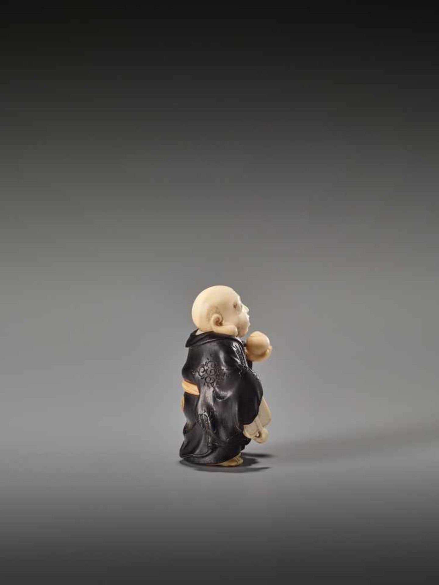 A FINE TOKYO SCHOOL EBONY AND IVORY NETSUKE OF HOTEI BY TOYOSAIBy Toyosai, ebony wood and ivory - Image 6 of 9