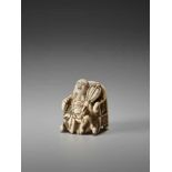 AN UNUSUAL IVORY NETSUKE OF HOTEI ON A THRONE BY CHIKUSAIBy Chikusai, ivory netsukeJapan, mid-19th