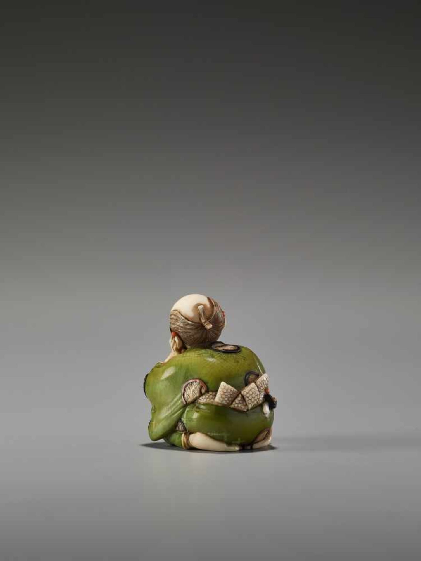 A FINE TOKYO-SCHOOL IVORY NETSUKE OF A MAN WITH GLASSES AND AN ABACUS BY YASUMASABy Yasumasa ( - Image 4 of 9