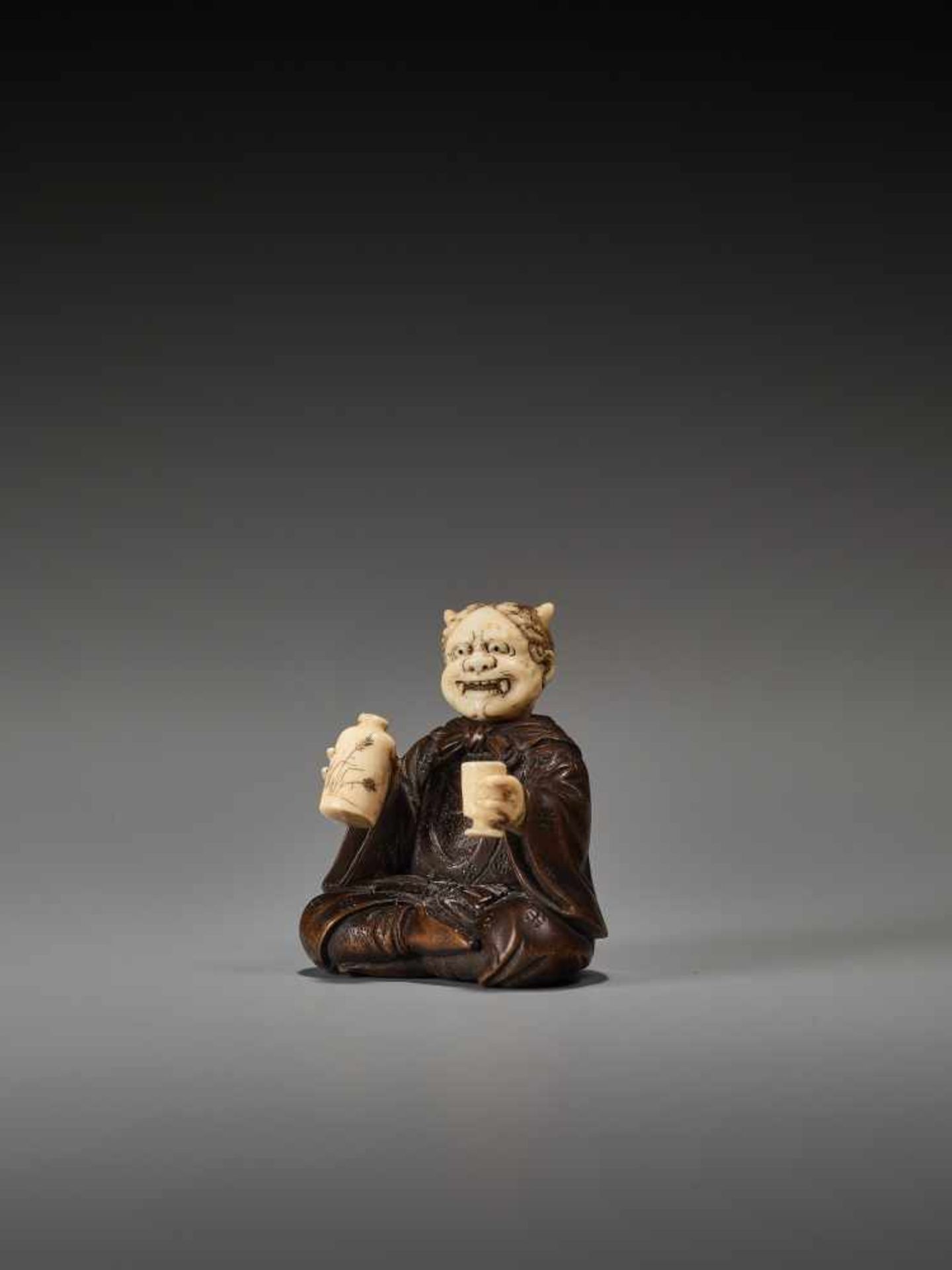 AN UNUSUAL WOOD AND IVORY NETSUKE OF A DRUNKEN ONI BY HOMINBy Homin, wood and ivory netsukeJapan, - Bild 2 aus 9