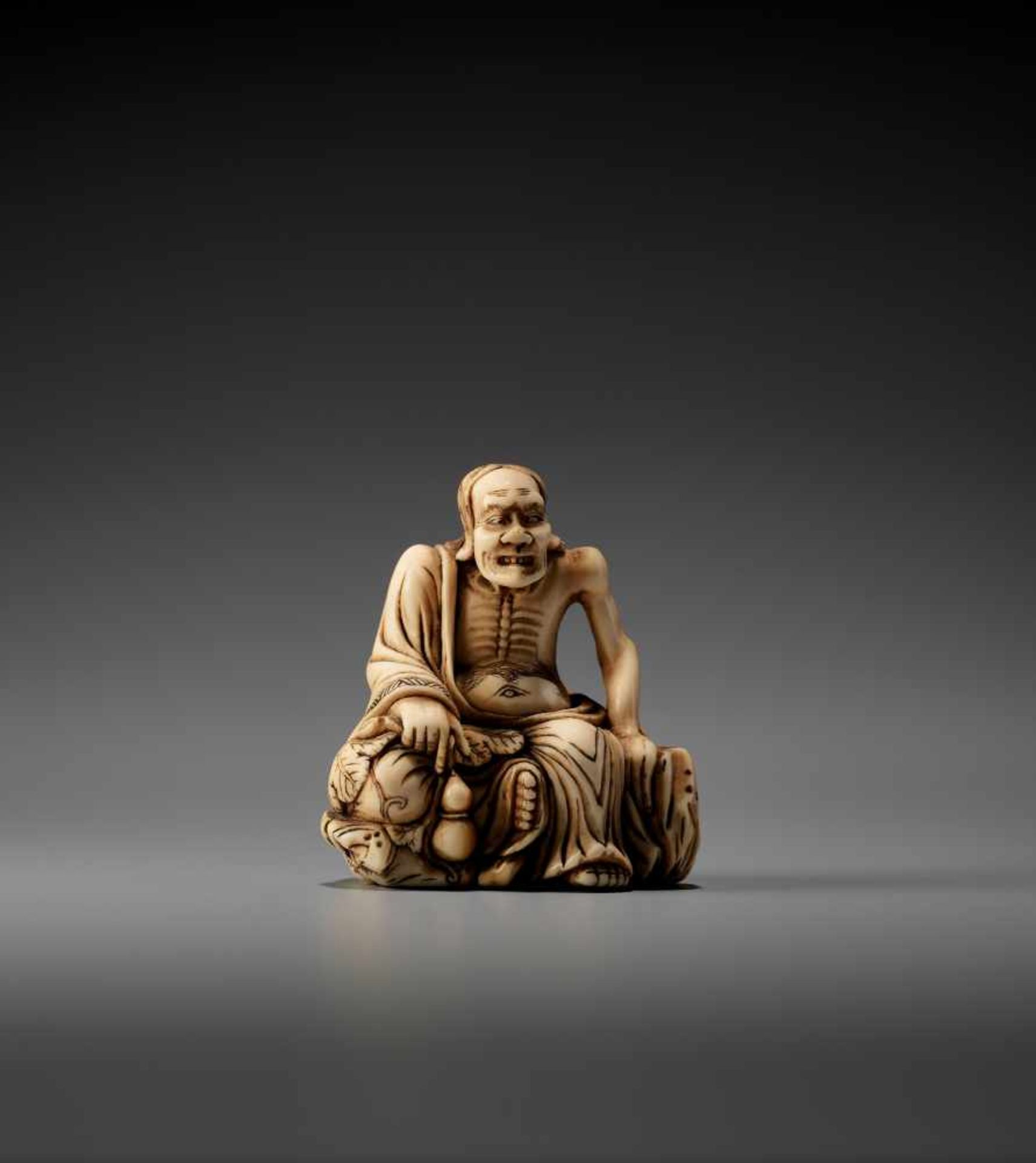 AN IVORY NETSUKE OF A RAKAN ON A ROCK BY ZOKOKUBy Zokoku, ivory netsukeJapan, 19th century, Edo