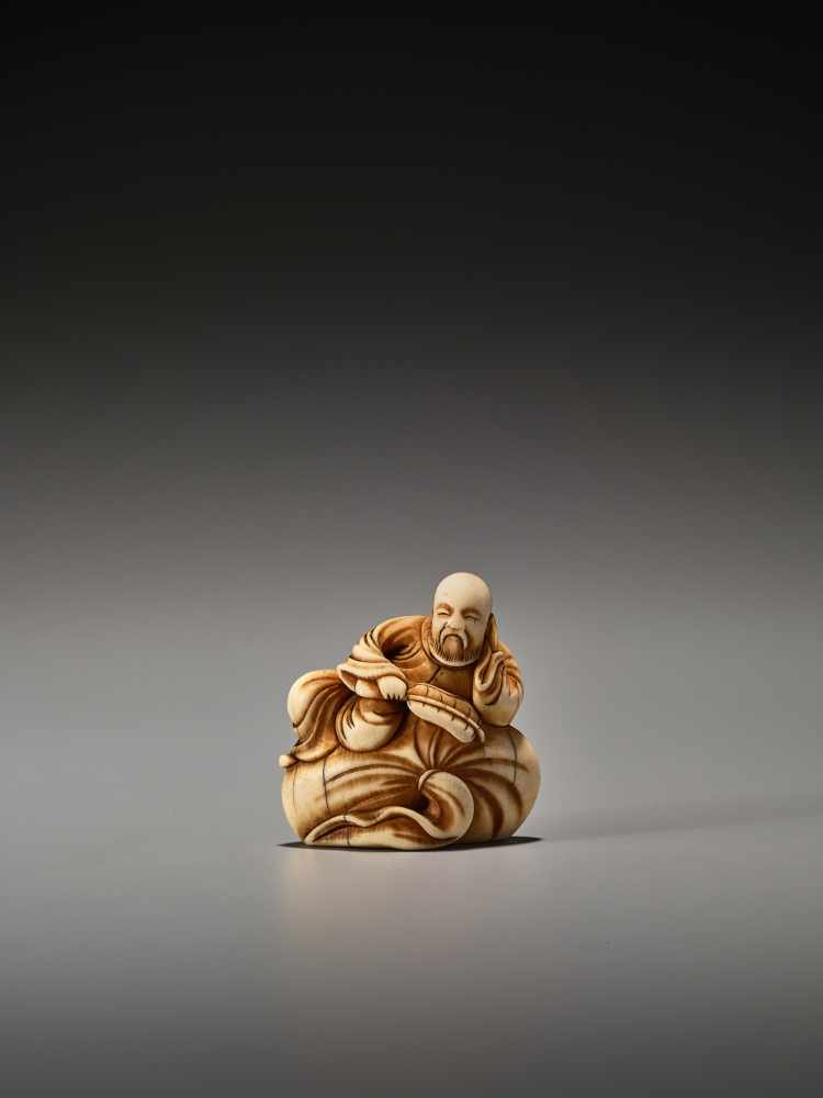 AN EARLY IVORY NETSUKE OF A CHINESE SAGE ON A LARGE BAGUnsigned, ivory netsukeJapan, 18th century,