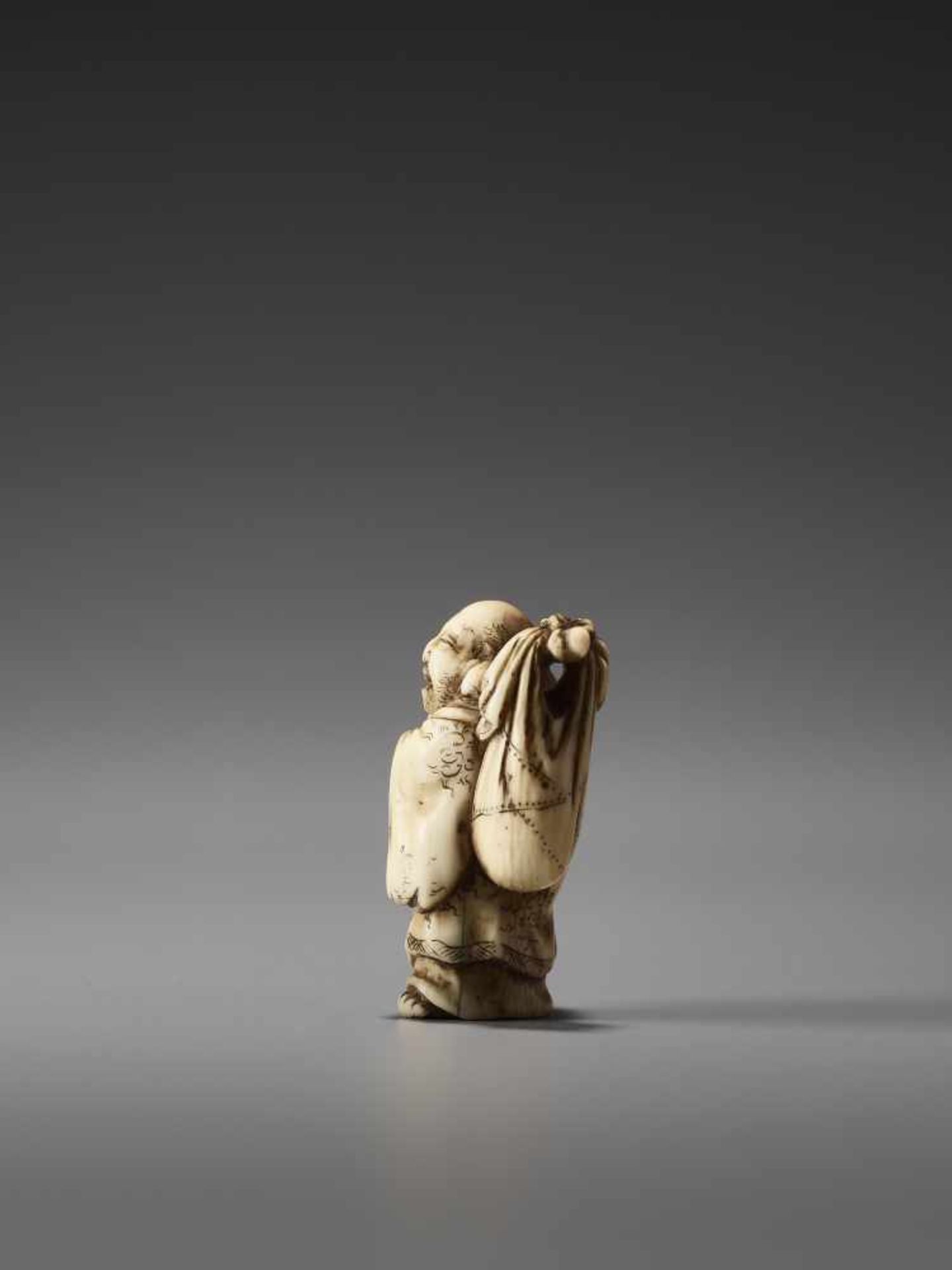 AN IVORY NETSUKE OF HOTEI AND A BOY BY MASATOSHIBy Masatoshi, ivory netsukeJapan, Tokyo, mid-19th - Image 3 of 7