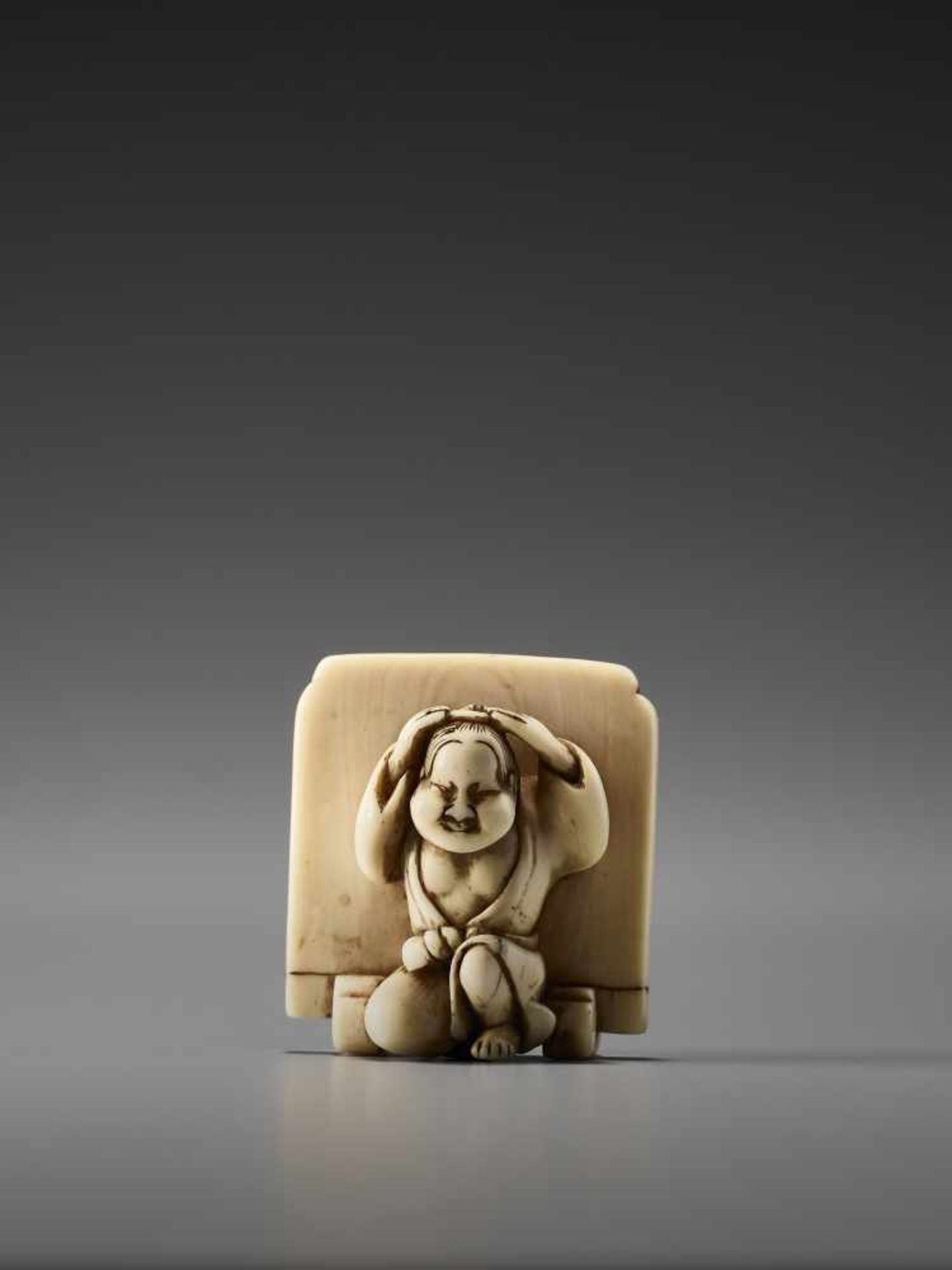 AN IVORY NETSUKE OF OKAME IN FRONT OF A SCREEN BY HIDEMASABy Hidemasa, ivory netsukeJapan, Osaka,