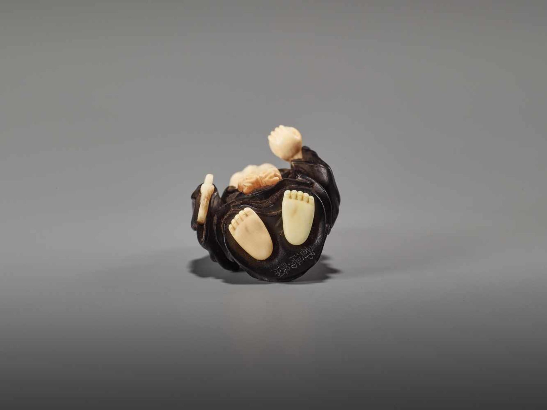 A FINE TOKYO SCHOOL EBONY AND IVORY NETSUKE OF HOTEI BY TOYOSAIBy Toyosai, ebony wood and ivory - Image 7 of 9