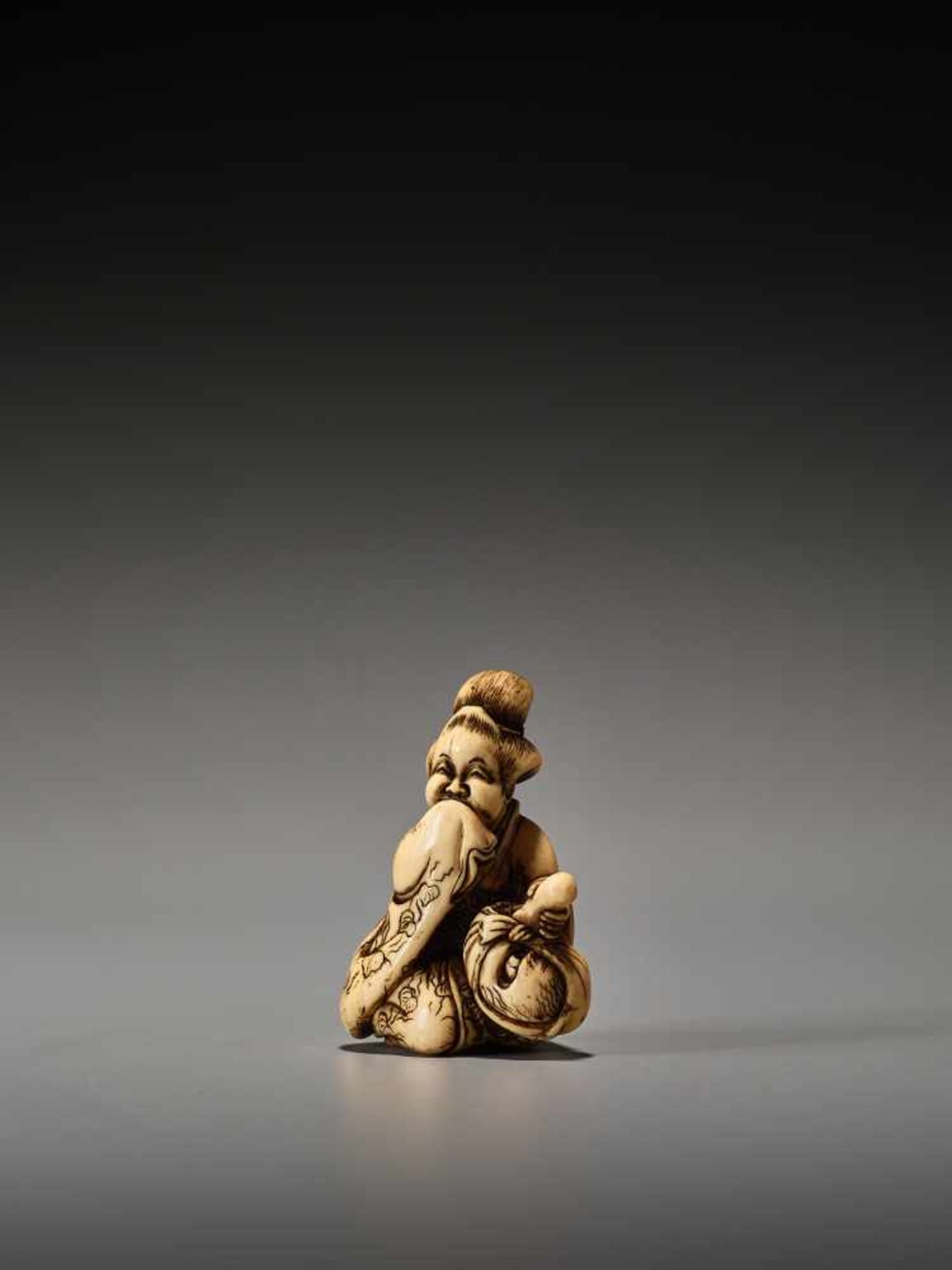 A RARE IVORY SHUNGA NETSUKE OF OKAME WITH TENGU MASK BY SHUOSAI HIDEMASABy Shuosai (Hidemasa), ivory