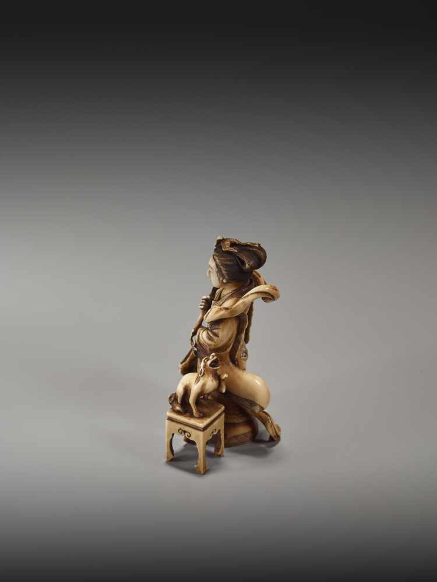 A FINE NETSUKE OKIMONO OF A CHINESE IMMORTAL WITH MYTHICAL DOG BY TEIMINBy Teimin, ivory okimono- - Image 2 of 9