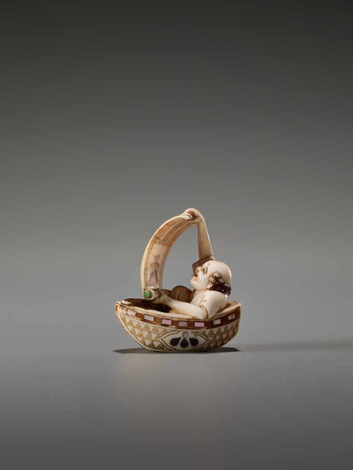 A TOKYO-SCHOOL IVORY NETSUKE OF A FISHERMAN IN A BOAT BY KUSANBy Kusan, ivory netsuke with