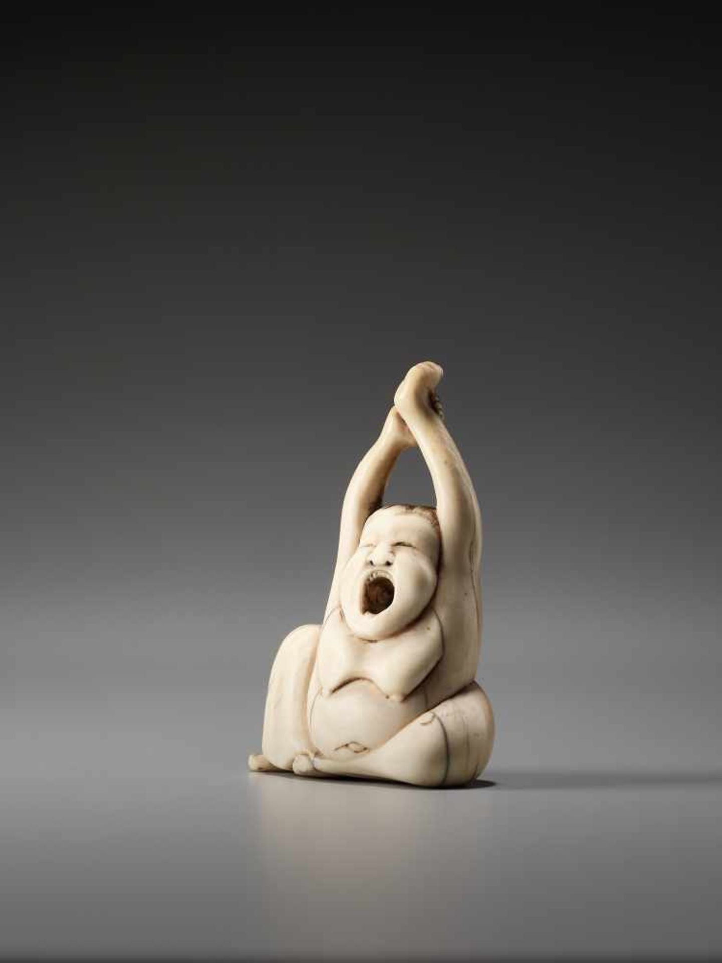 AN IVORY NETSUKE OF OKAME YAWNINGUnsigned, ivory netsukeJapan, early 19th century, Edo period ( - Image 2 of 6