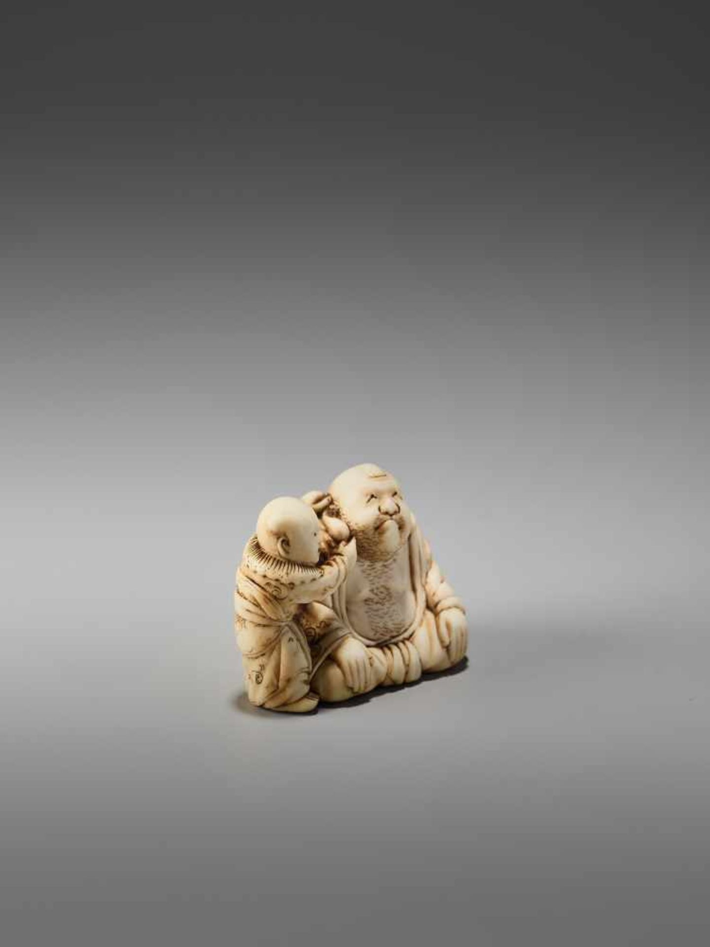 AN IVORY NETSUKE OF HOTEI PLAYING KAMIFUKI AND A KARAKO BY MINZANBy Minzan, ivory netsukeJapan, - Image 4 of 7