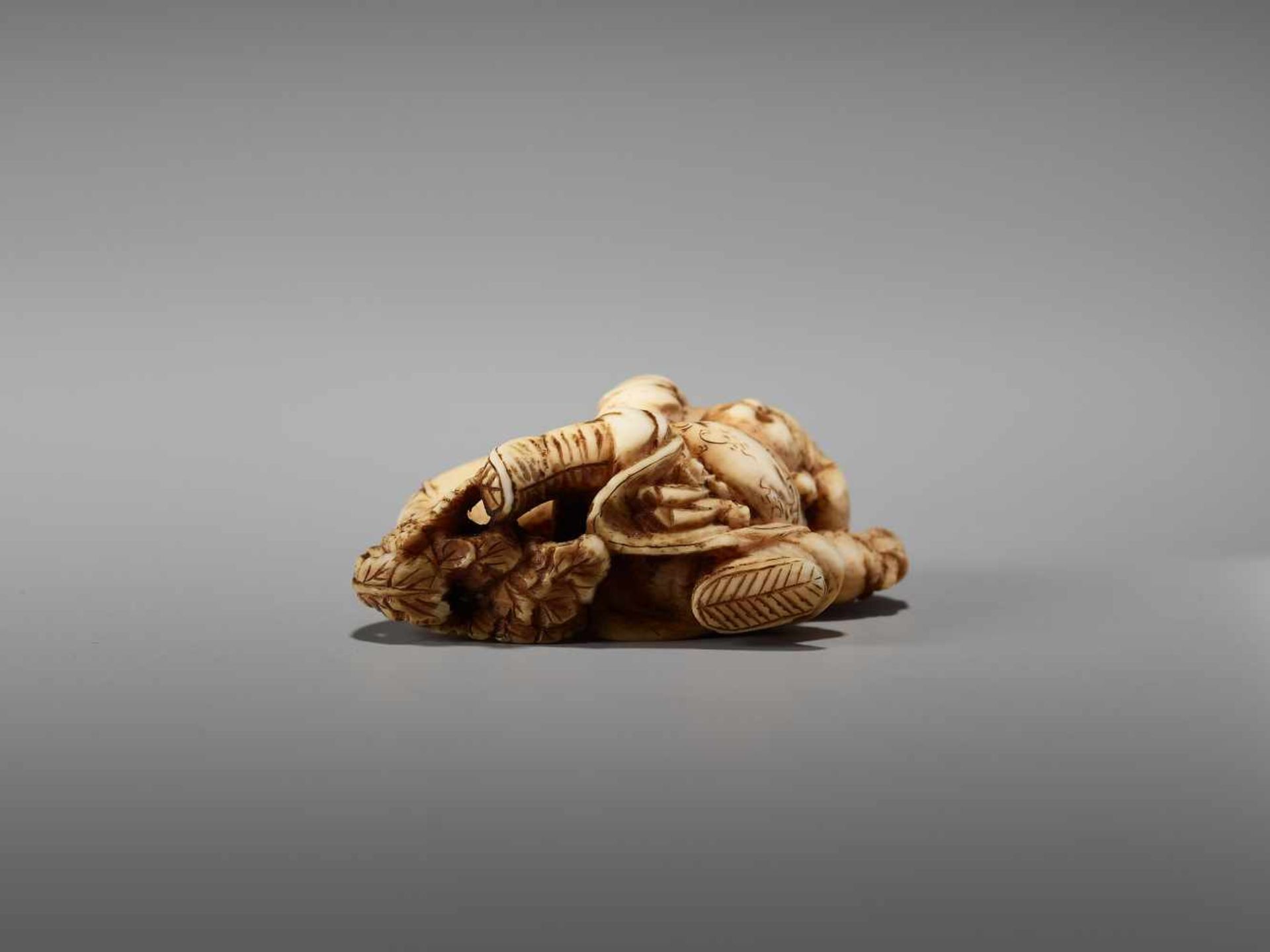 A SMALL IVORY NETSUKE OF DAIKOKU WITH DAIKON AND RAT BY THE TOMOCHIKA SCHOOLBy Tomochika, ivory - Image 7 of 9