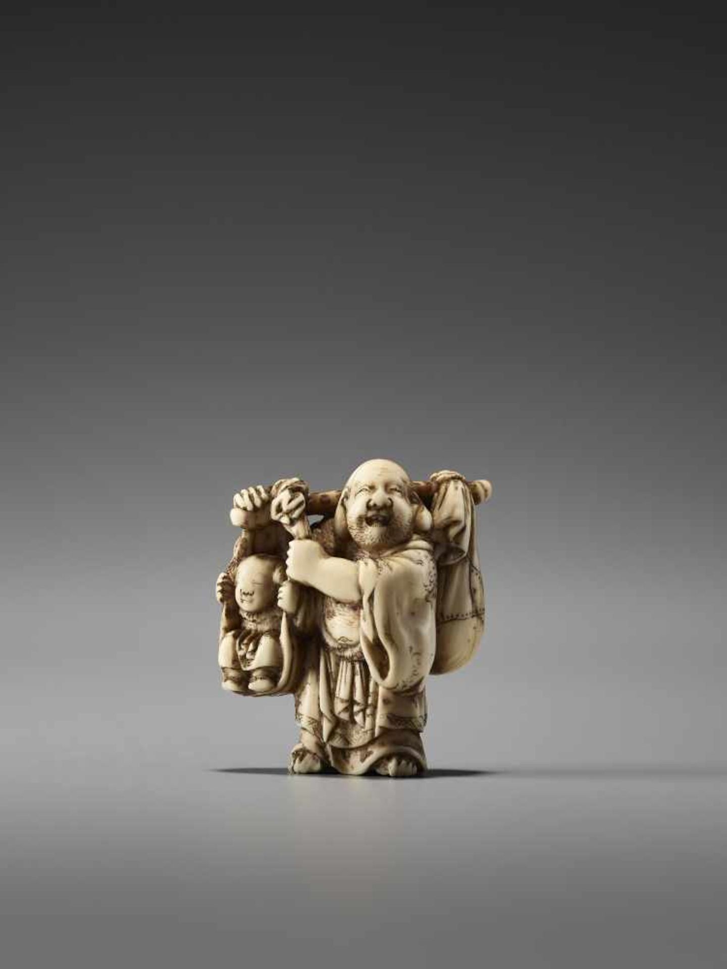 AN IVORY NETSUKE OF HOTEI AND A BOY BY MASATOSHIBy Masatoshi, ivory netsukeJapan, Tokyo, mid-19th