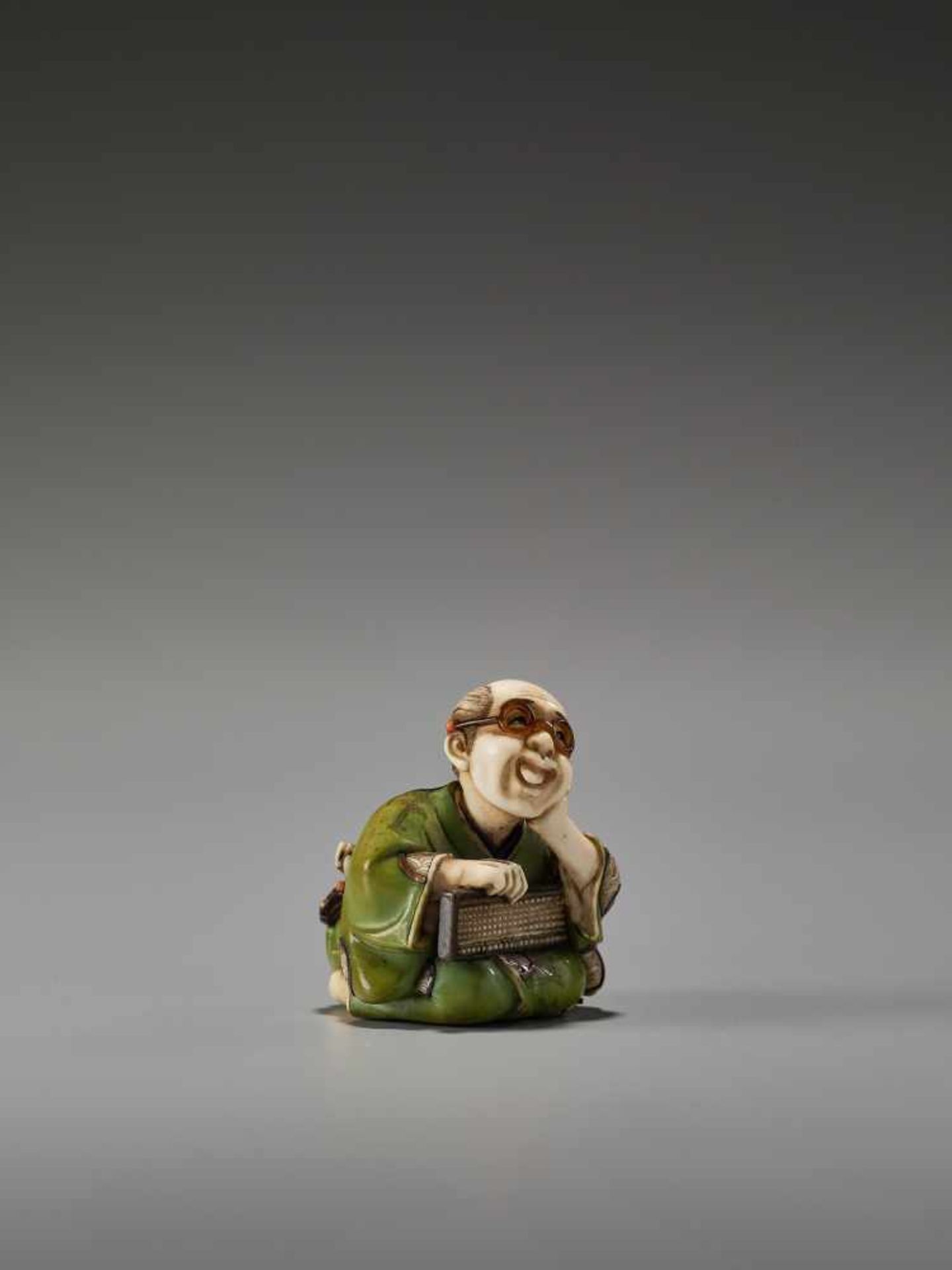 A FINE TOKYO-SCHOOL IVORY NETSUKE OF A MAN WITH GLASSES AND AN ABACUS BY YASUMASABy Yasumasa ( - Image 5 of 9