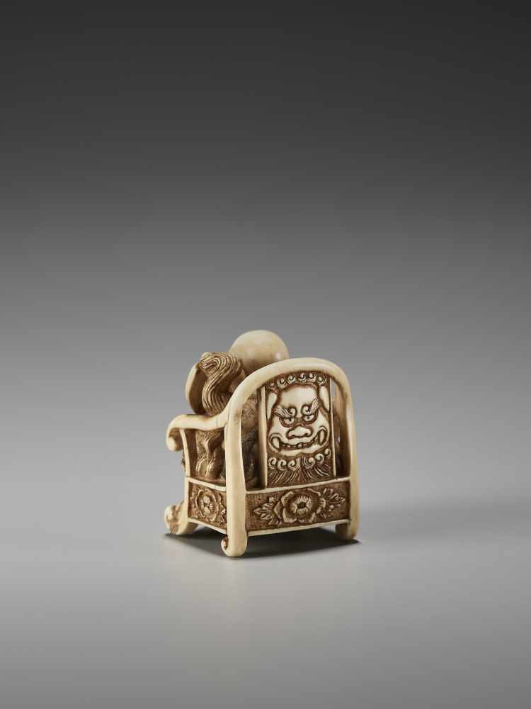 AN UNUSUAL IVORY NETSUKE OF HOTEI ON A THRONE BY CHIKUSAIBy Chikusai, ivory netsukeJapan, mid-19th - Image 4 of 9